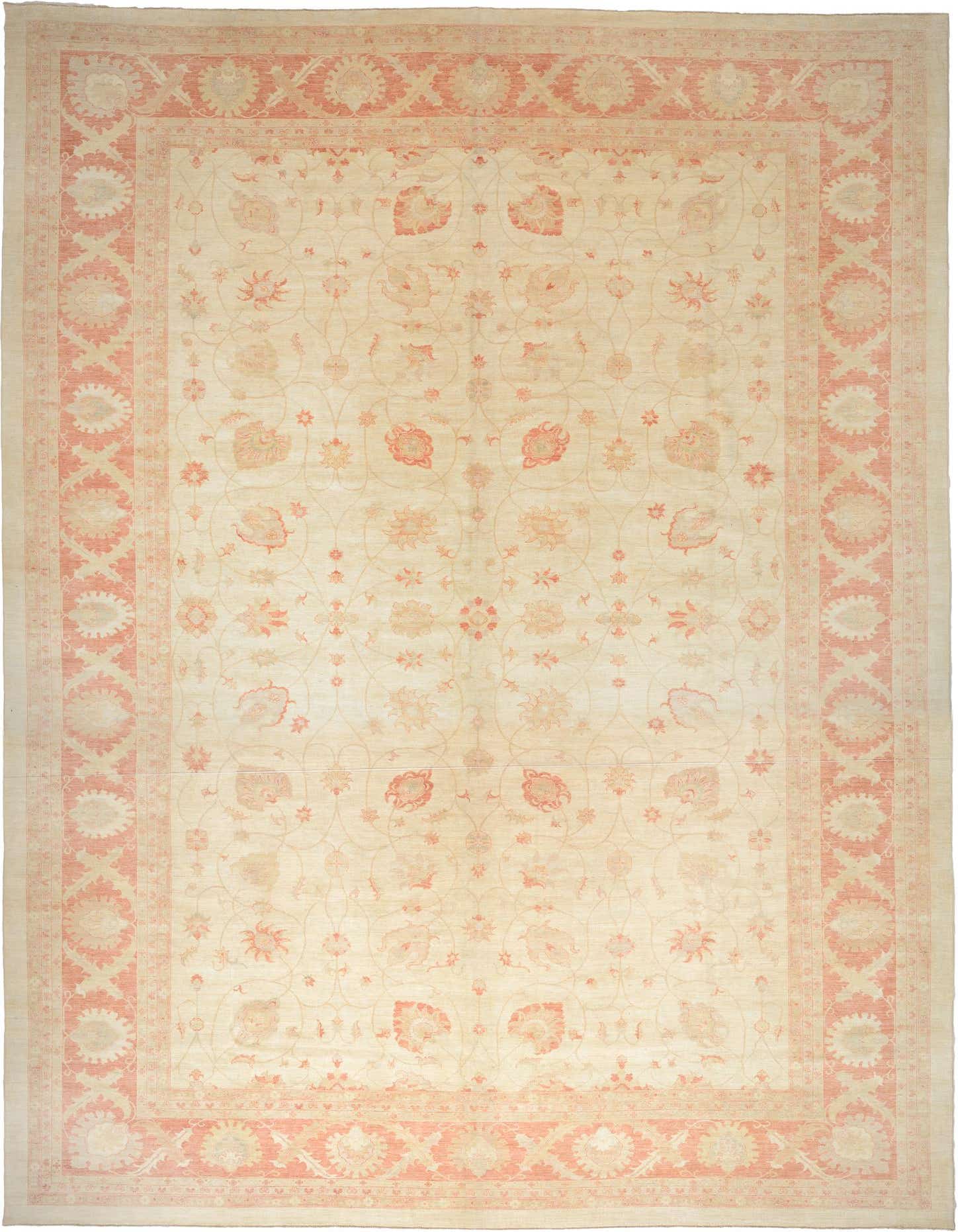 A large 13x18 rectangular ivory Peshawar Ziegler rug with a traditional botanical and floral pattern in soft peach and cream tones, perfect for a living room.