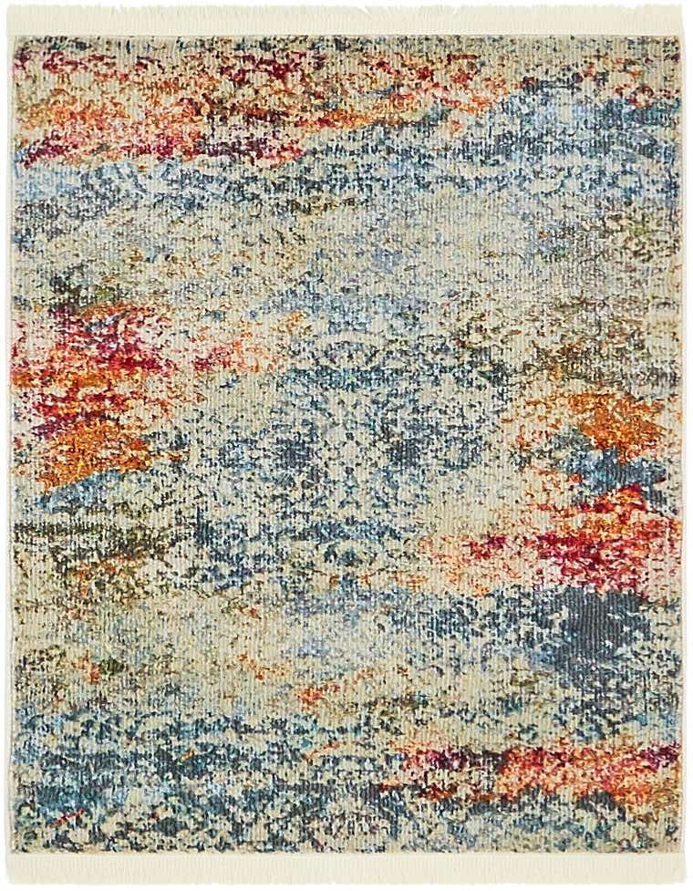 A 2x3 rectangular Santiago rug featuring an eclectic, modern distressed pattern in ivories, creams, blues, and reds, with short fringe.