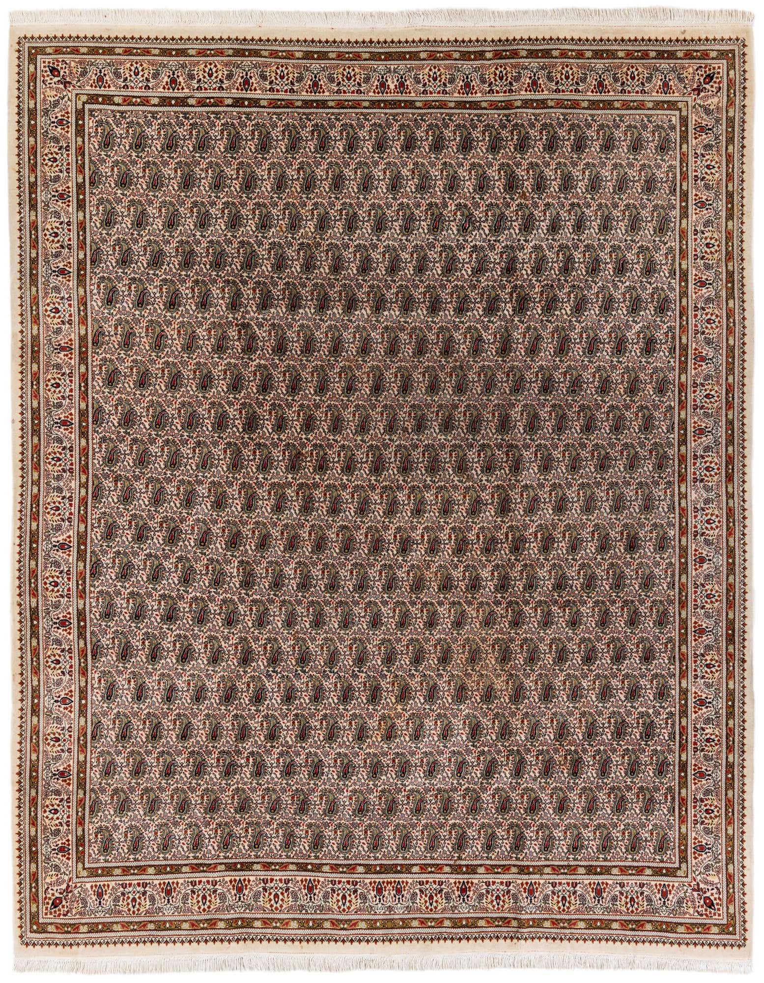 A 7x10 rectangular ivory wool rug with a traditional Oriental paisley pattern and an ornate border, suitable for a living room.
