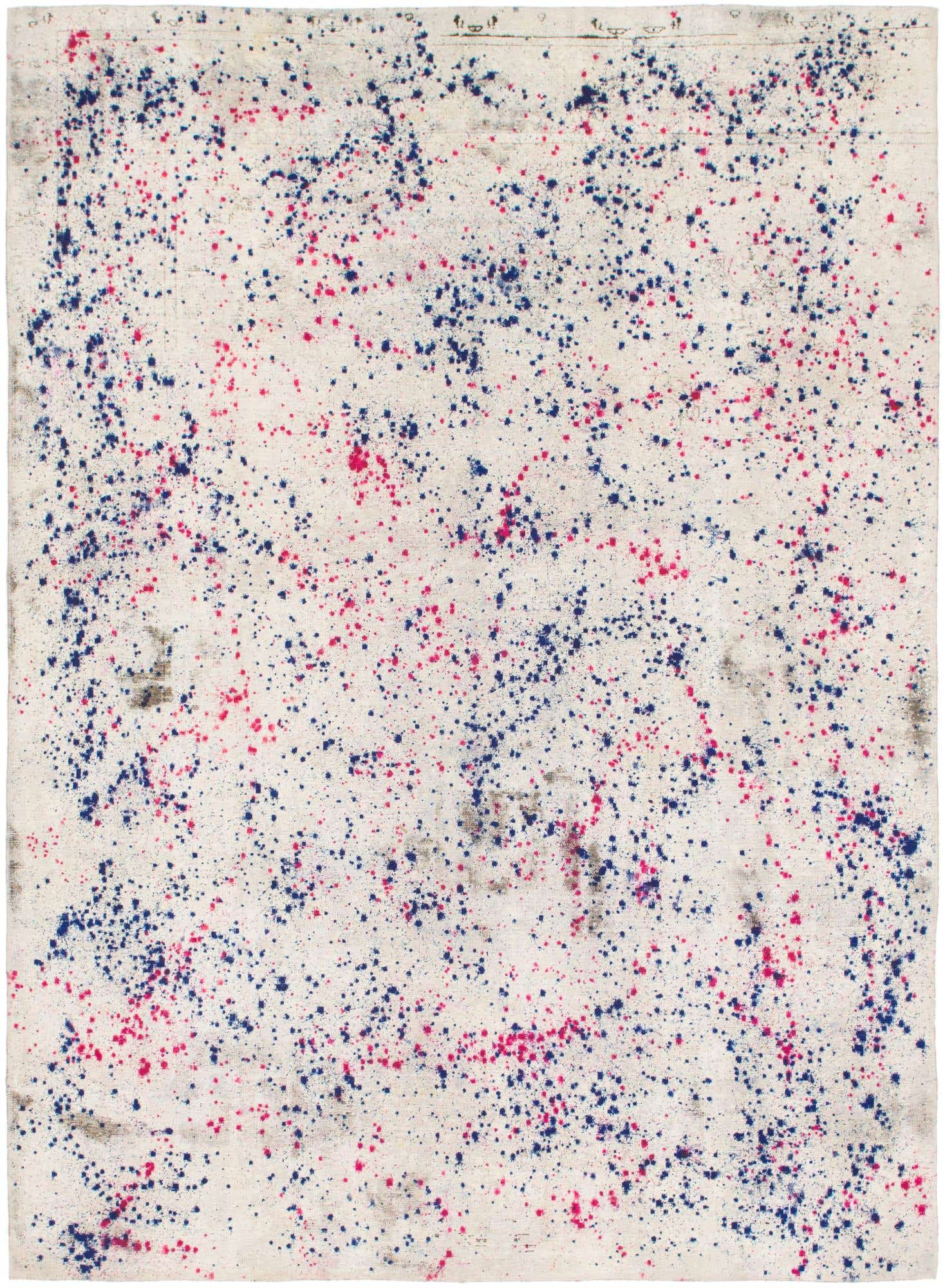A 7x10 rectangular ivory wool rug with a vibrant abstract pattern of scattered blue and pink speckles.