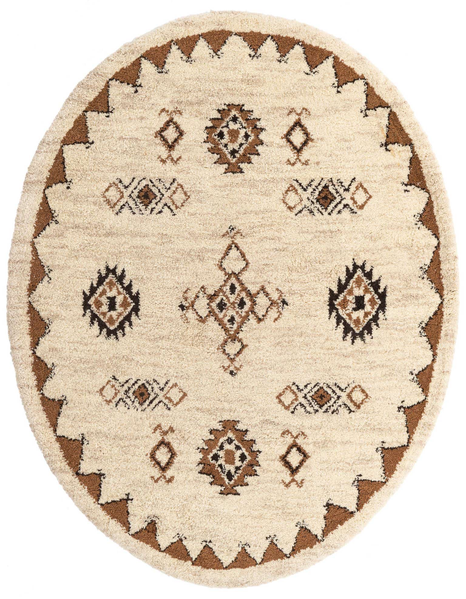 Round ivory shag rug with a brown tribal border and geometric patterns in brown and black across the center.