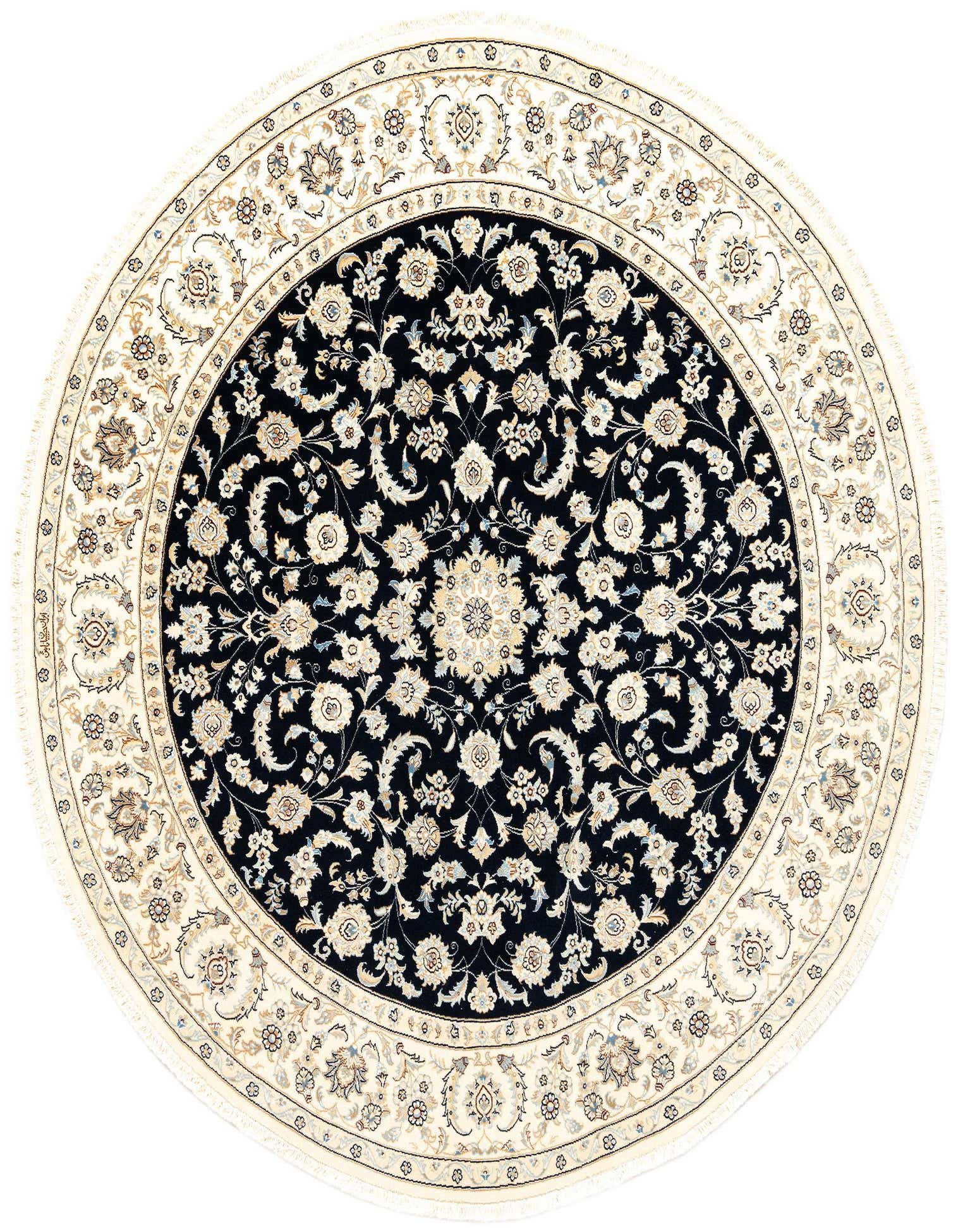 A round, handmade 6' 7" Persian rug with a cream border and a dark navy center, featuring intricate floral and medallion patterns in ivory and beige.