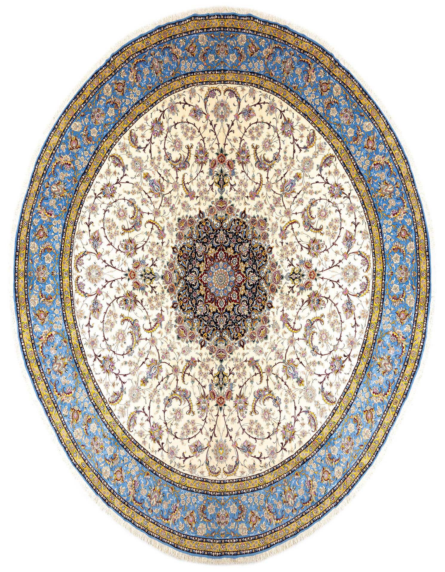 A large round ivory Persian rug with intricate floral motifs in blue, gold, and red, featuring a prominent central medallion and a wide blue border.
