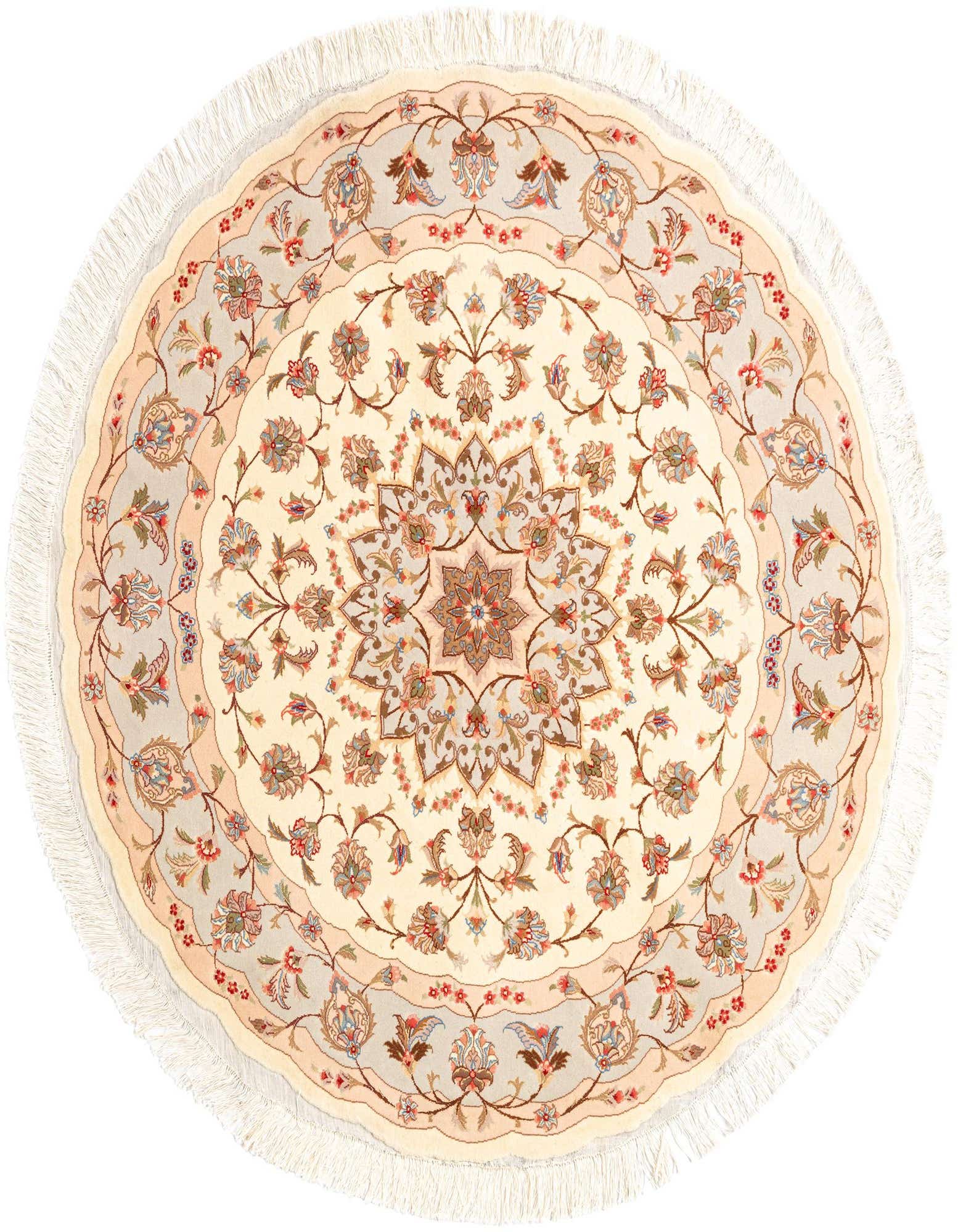 A round 4'11" ivory Persian rug with a detailed floral medallion pattern in creams, blues, and reds, featuring a fringed edge.