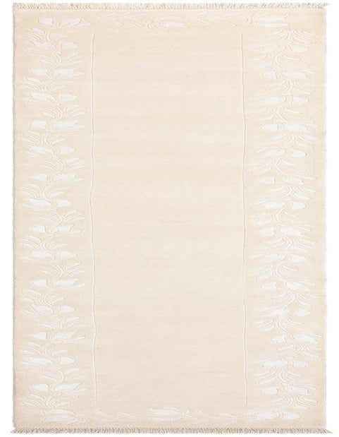 A 13 ft ivory wool runner rug with a raised floral border pattern and fringe, perfect for a hallway.