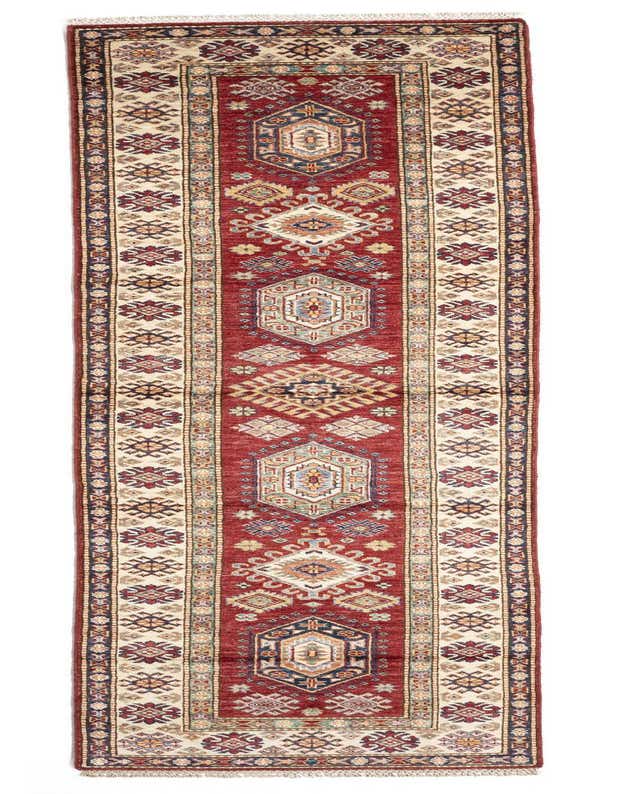 A handmade 11 ft runner rug with a central red field and ivory borders, featuring intricate traditional Persian patterns, ideal for a hallway.