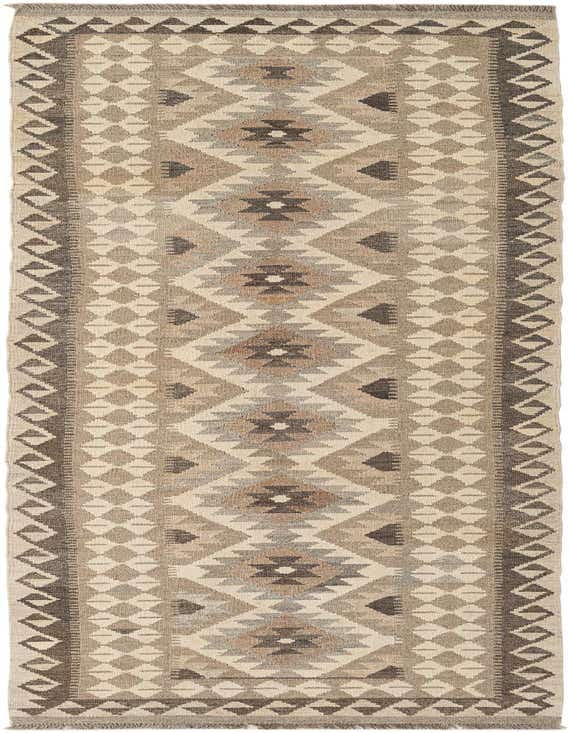 A 10 ft runner rug in ivory and cream with a flatweave tribal pattern, ideal for hallways.