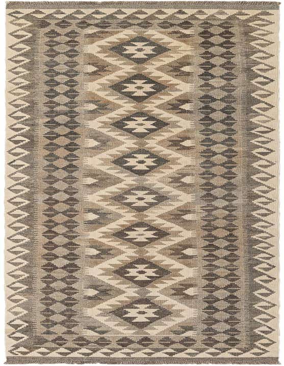 A 10 ft runner rug featuring a tribal geometric pattern in shades of ivory, cream, and dark brown, ideal for a hallway.