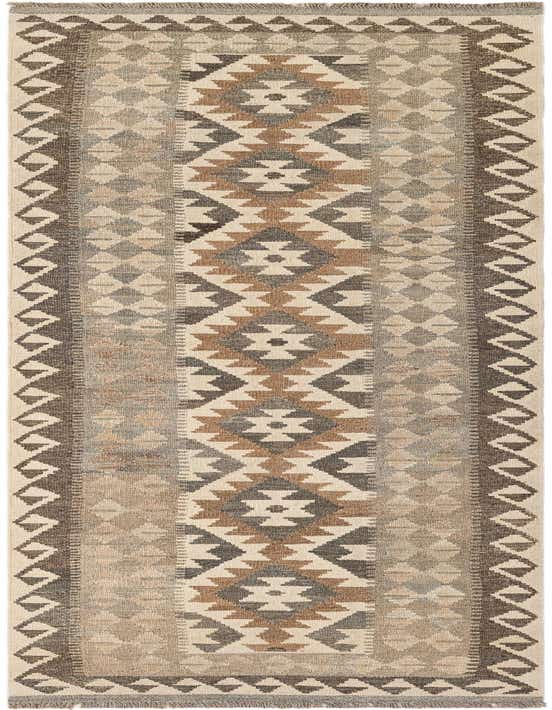 A 10 ft runner rug with a tribal pattern in ivories, creams, and earthy brown tones, perfect for a hallway.