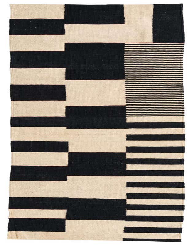 A 9 ft runner rug featuring a bold black and ivory tribal geometric pattern with horizontal stripes and blocks, perfect for a hallway.