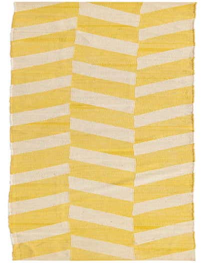 A 13 ft runner rug with a modern tribal pattern in ivory and yellow, featuring large geometric shapes.