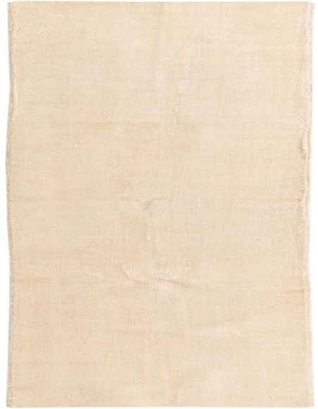 A 12 ft runner rug in a solid ivory color, handmade from hand-spun wool, ideal for a hallway.