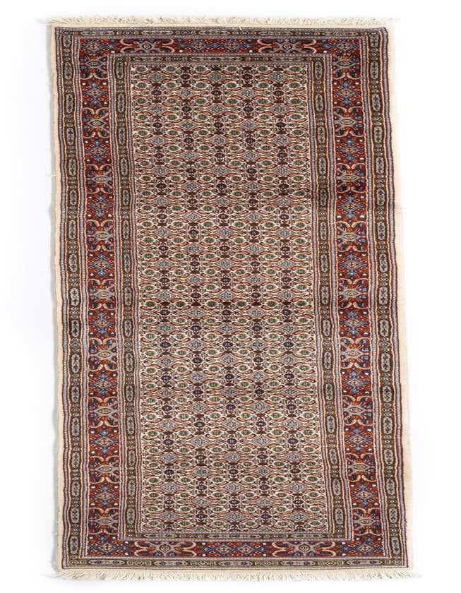 A 9 ft runner rug with a cream background and intricate Persian pattern in red, blue, green, and brown, featuring a decorative border and fringe.