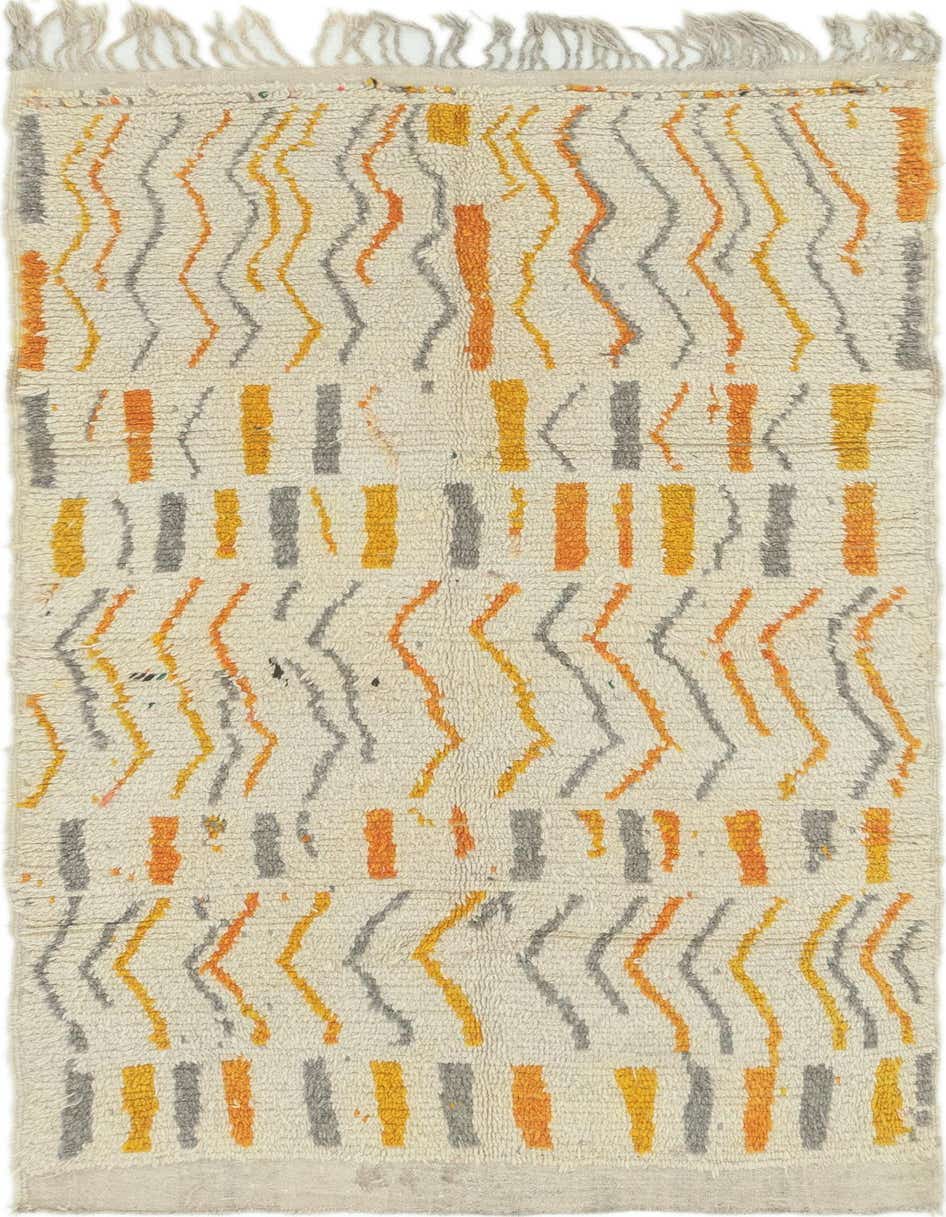 An 8 ft runner rug with a shag pile, featuring a tribal abstract pattern in ivory, orange, yellow, and gray, ideal for a hallway.