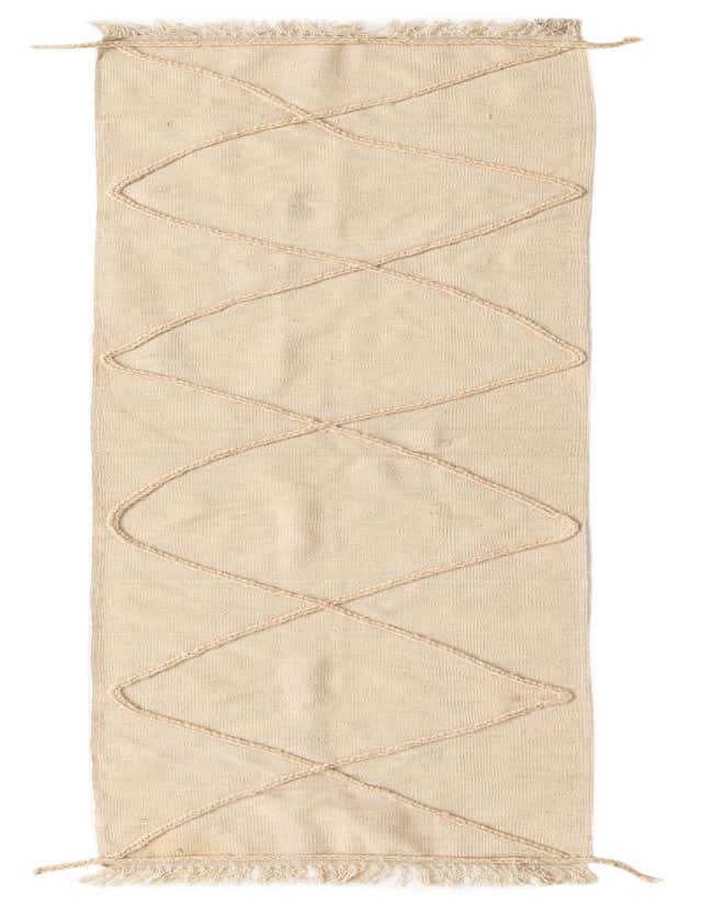 A 10 ft runner rug in ivory wool, featuring a modern tribal geometric pattern with braided accents and fringed ends.