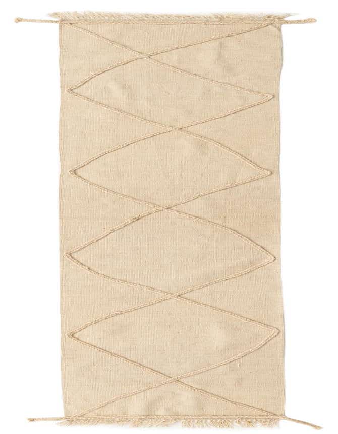 A 10 Ft runner rug in ivory cream wool with a tribal geometric diamond pattern, featuring braided details and fringed ends.