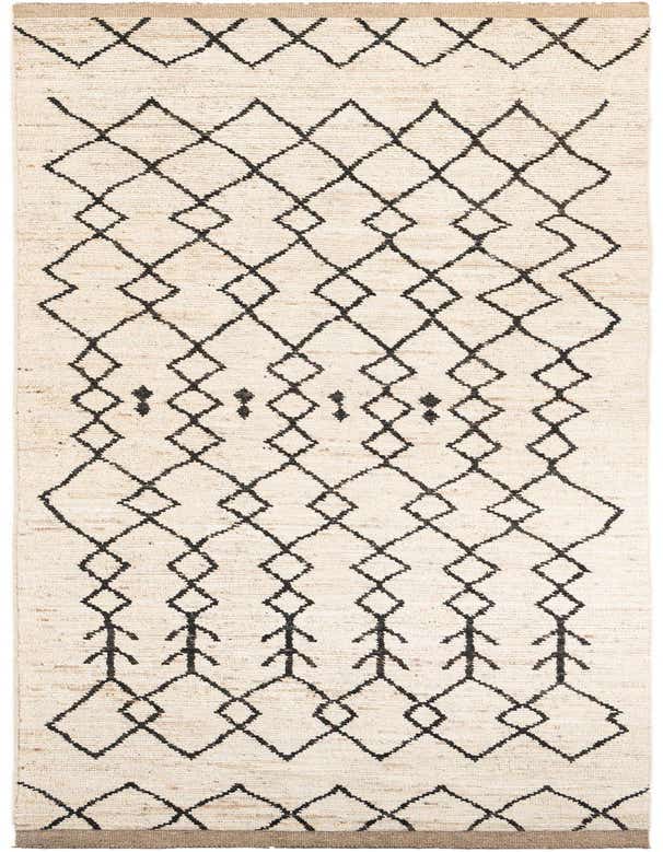 A 16 ft ivory wool runner rug with a black tribal diamond pattern, perfect for a hallway.