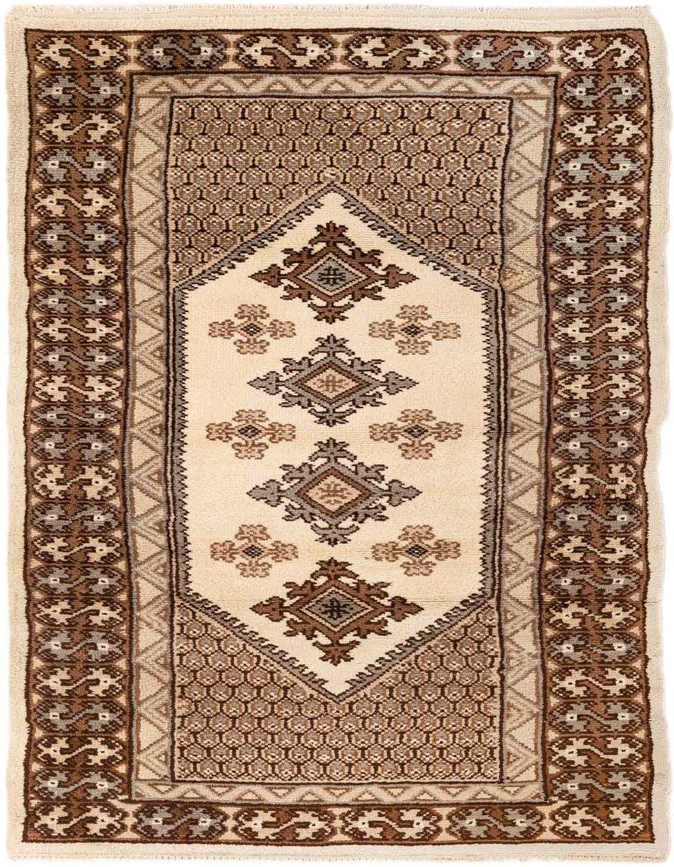 A 7 ft runner rug in ivory and brown, featuring a tribal medallion pattern, ideal for a hallway.