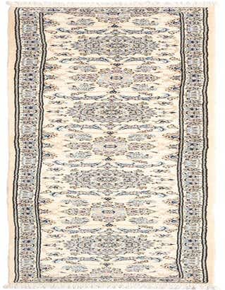 A 12 ft ivory runner rug with an intricate Persian floral medallion pattern in blues, creams, and light browns, suitable for a hallway.
