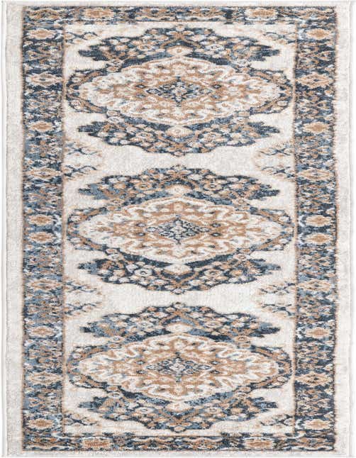 An 8 ft runner rug in ivory with a traditional medallion pattern in navy blue, light blue, and tan, perfect for a hallway or kitchen.