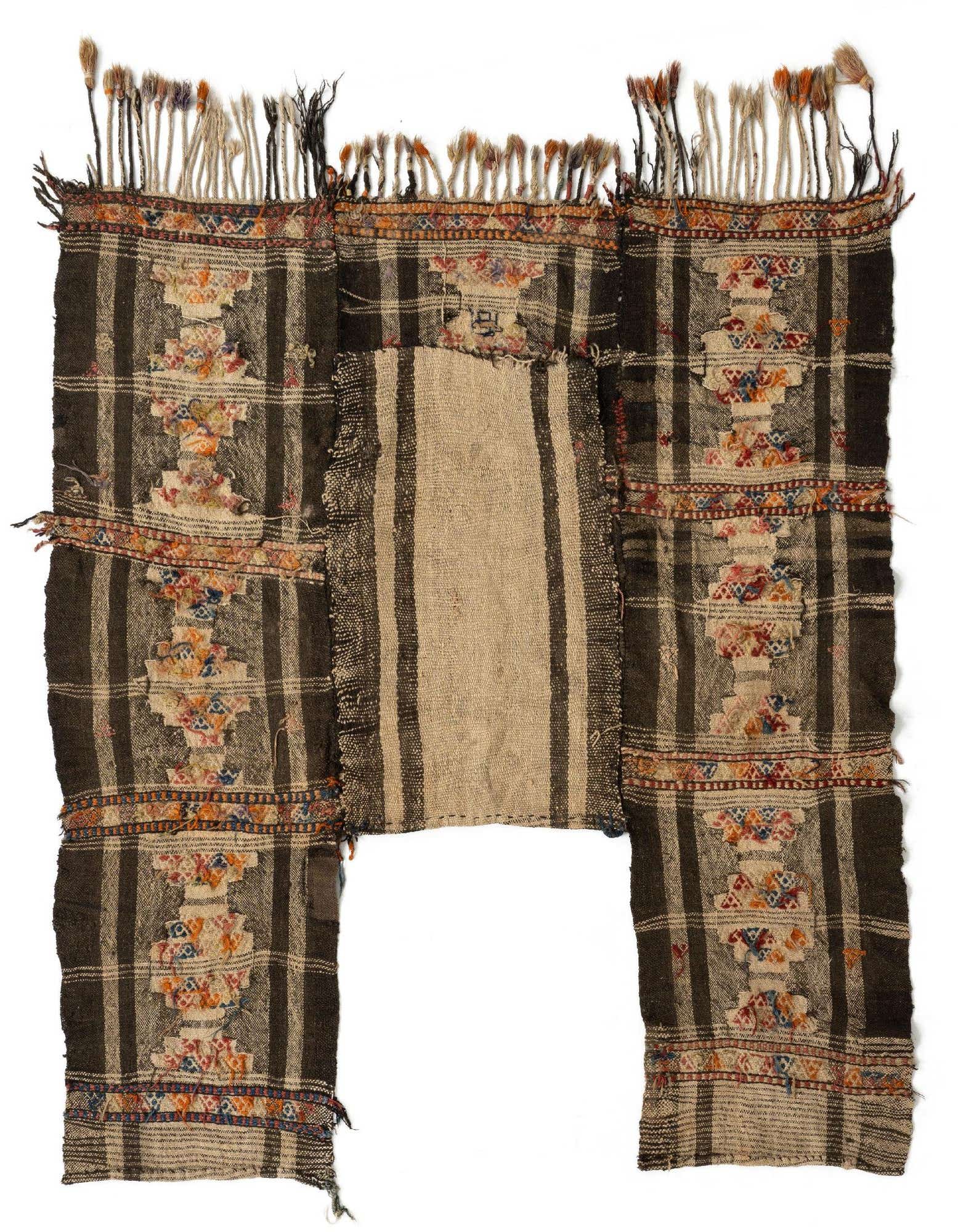 A handmade 5' 3 x 5' 7 square Kilim rug featuring a tribal Persian pattern in ivories, creams, and dark brown with colorful accents and fringe.