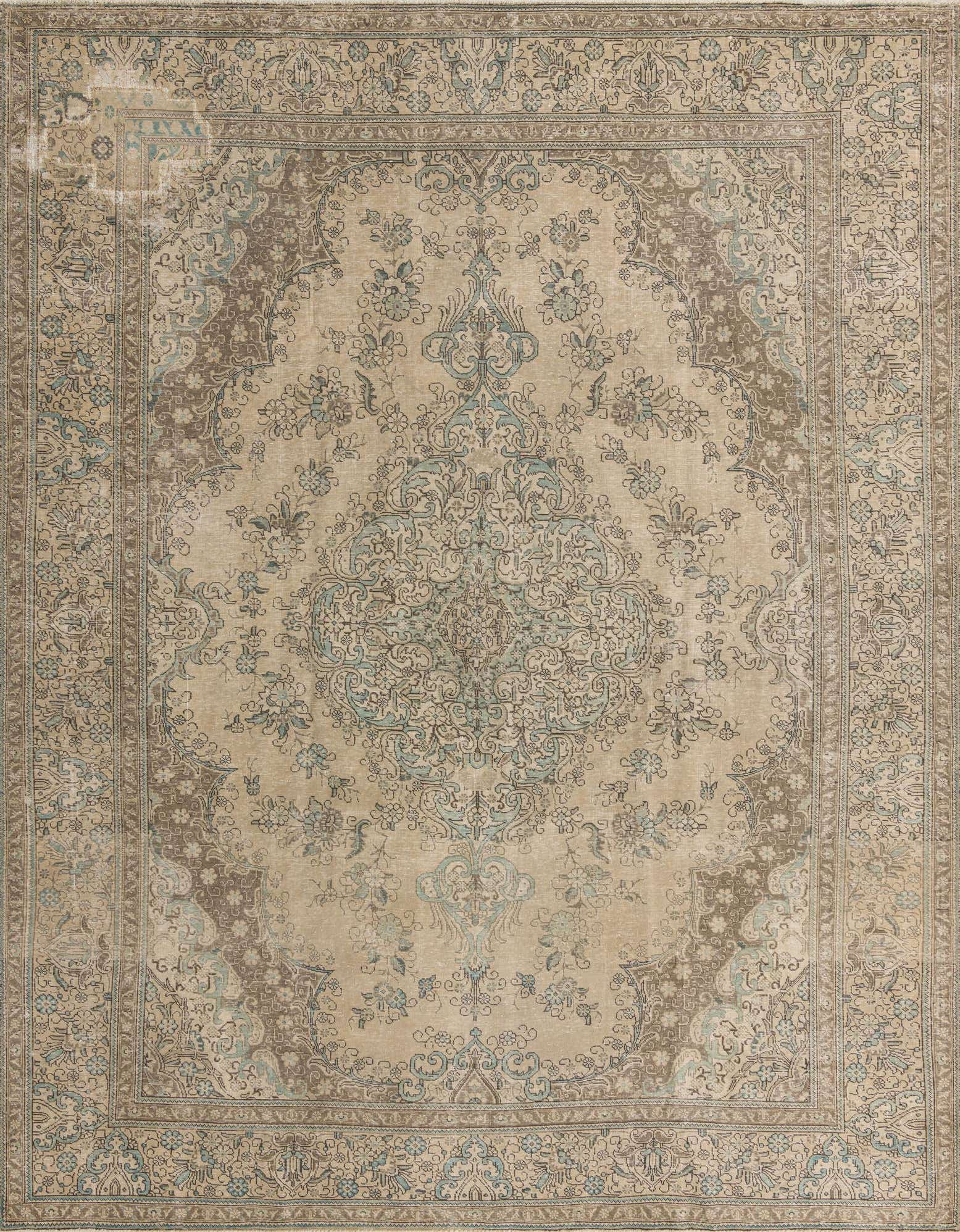 A 10x13 rectangular Persian rug with a faded medallion pattern in brown, tan, and light blue tones.