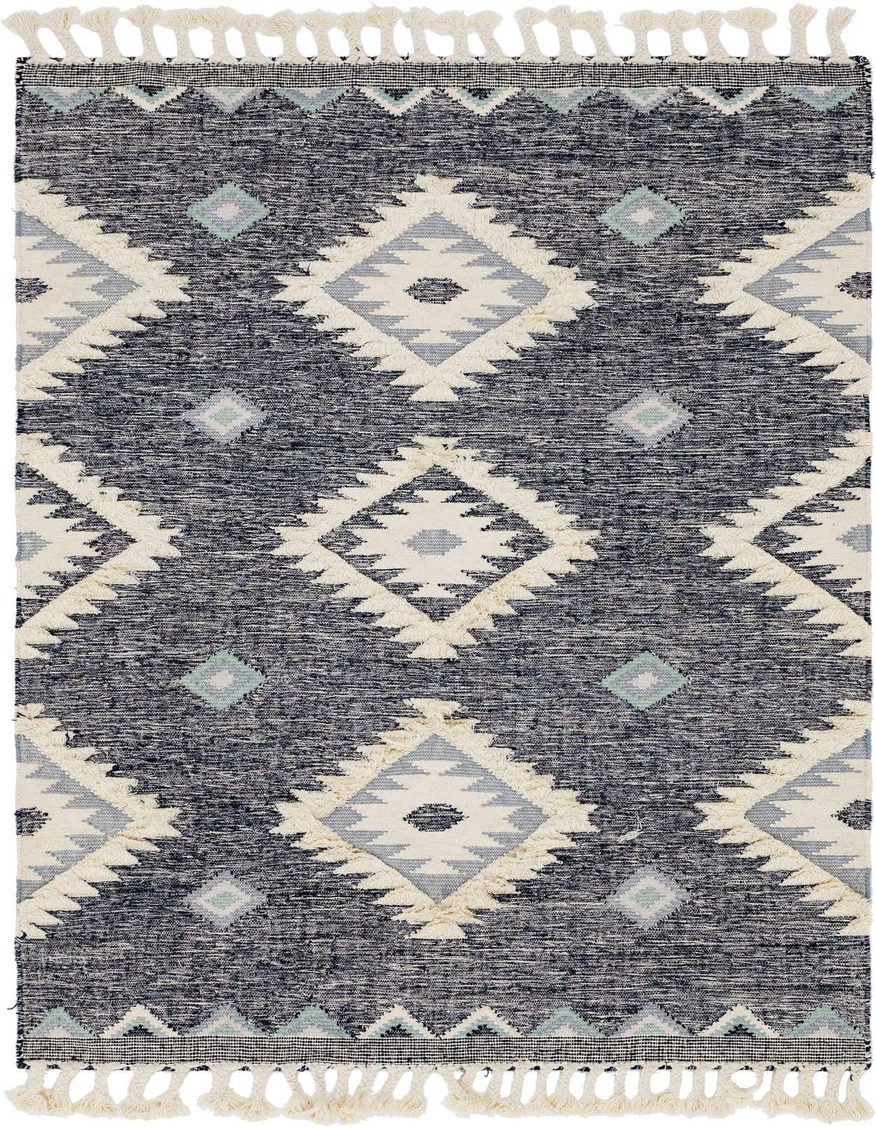 A 6x9 rectangular blue and cream wool rug with a Southwestern tribal diamond pattern and shag texture, featuring decorative tassels.