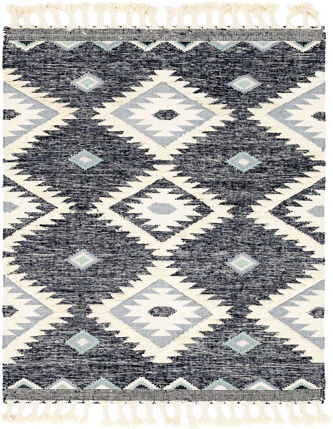A 5x8 rectangular blue and white wool rug with a Bohemian Southwestern tribal pattern and decorative tassels.