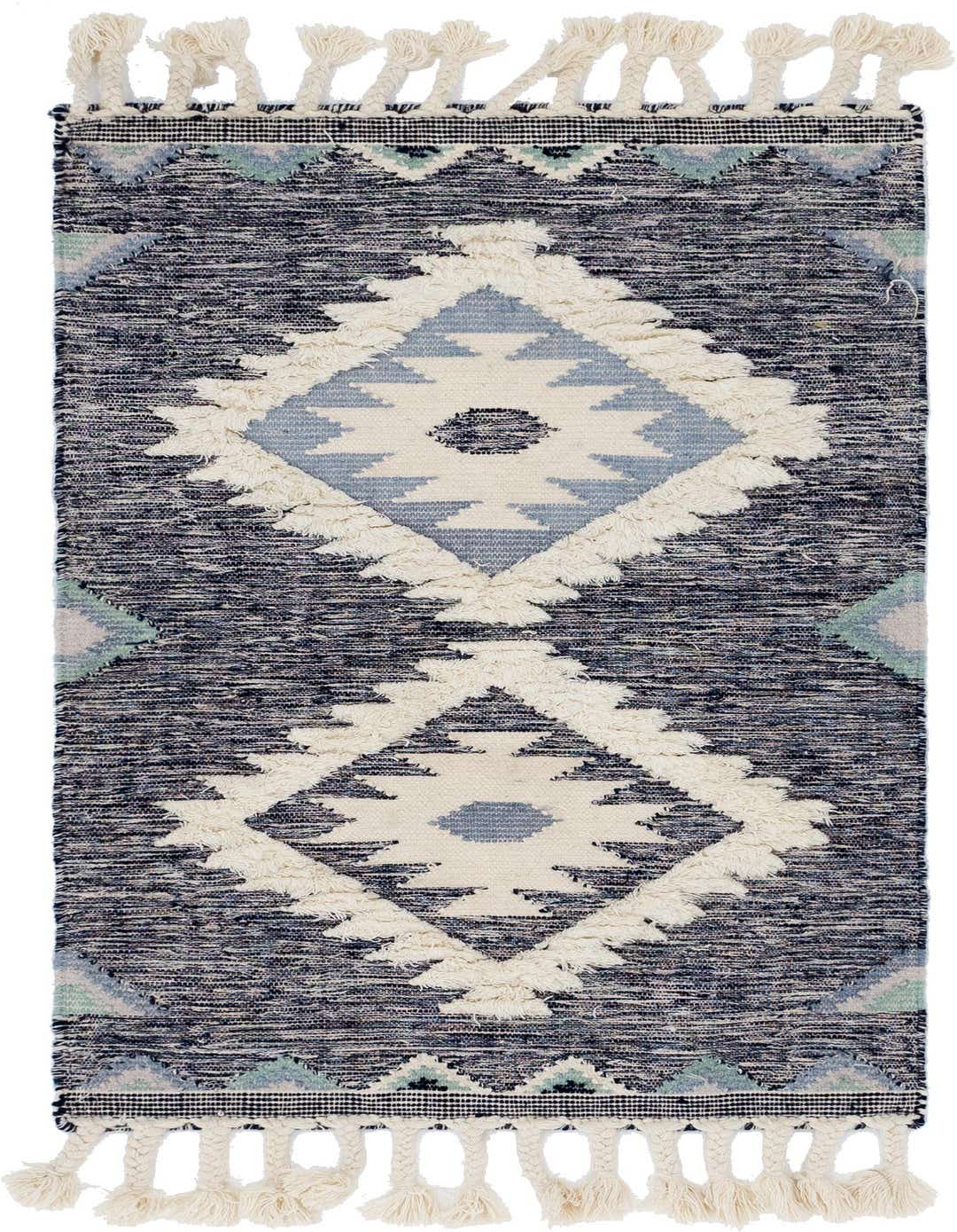 A 3x5 rectangular blue and cream tribal wool rug with a textured shag pile and decorative tassels.