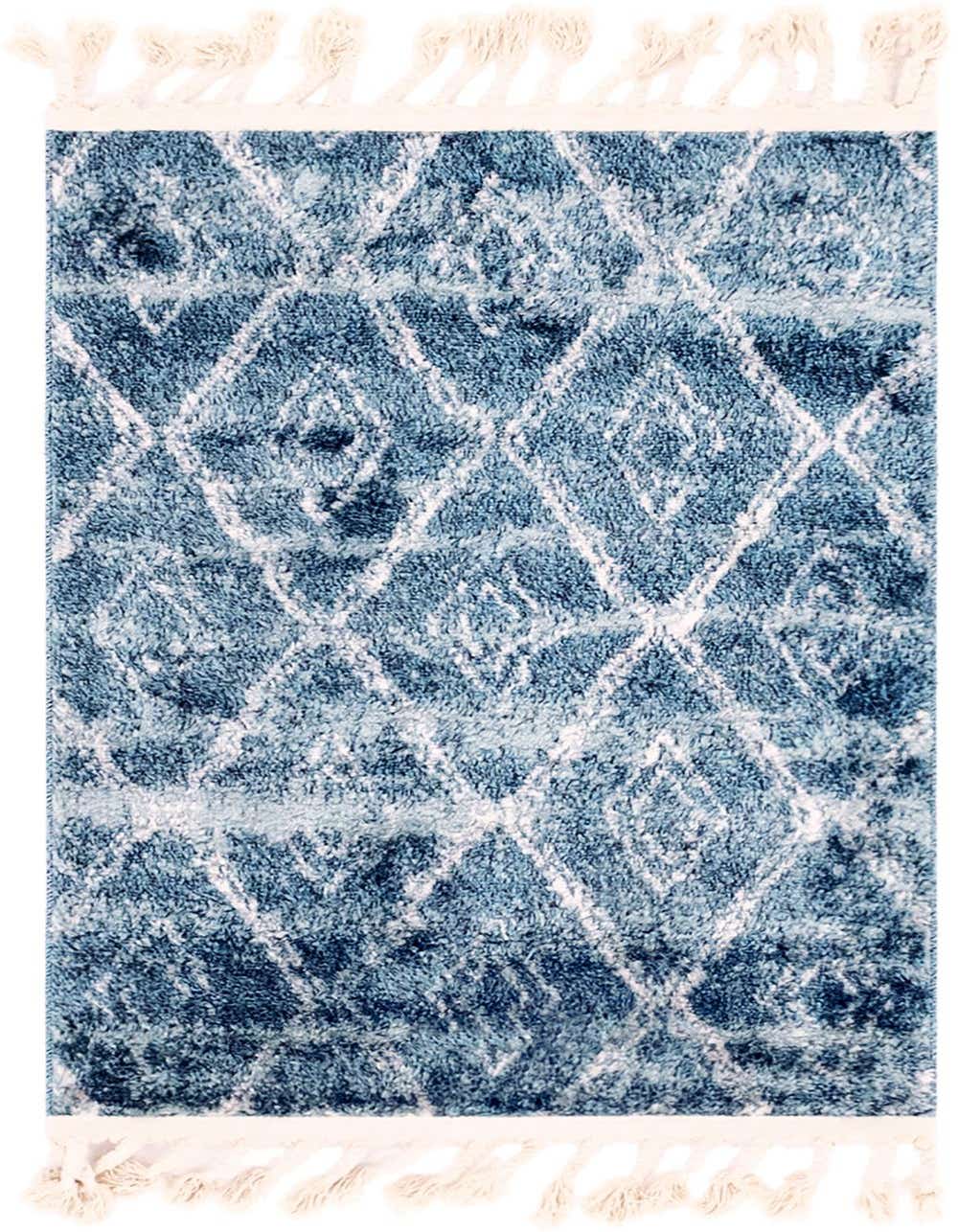 A 2x3 rectangular blue Bohemian rug with a white trellis pattern and fringed ends, suitable for indoor spaces.