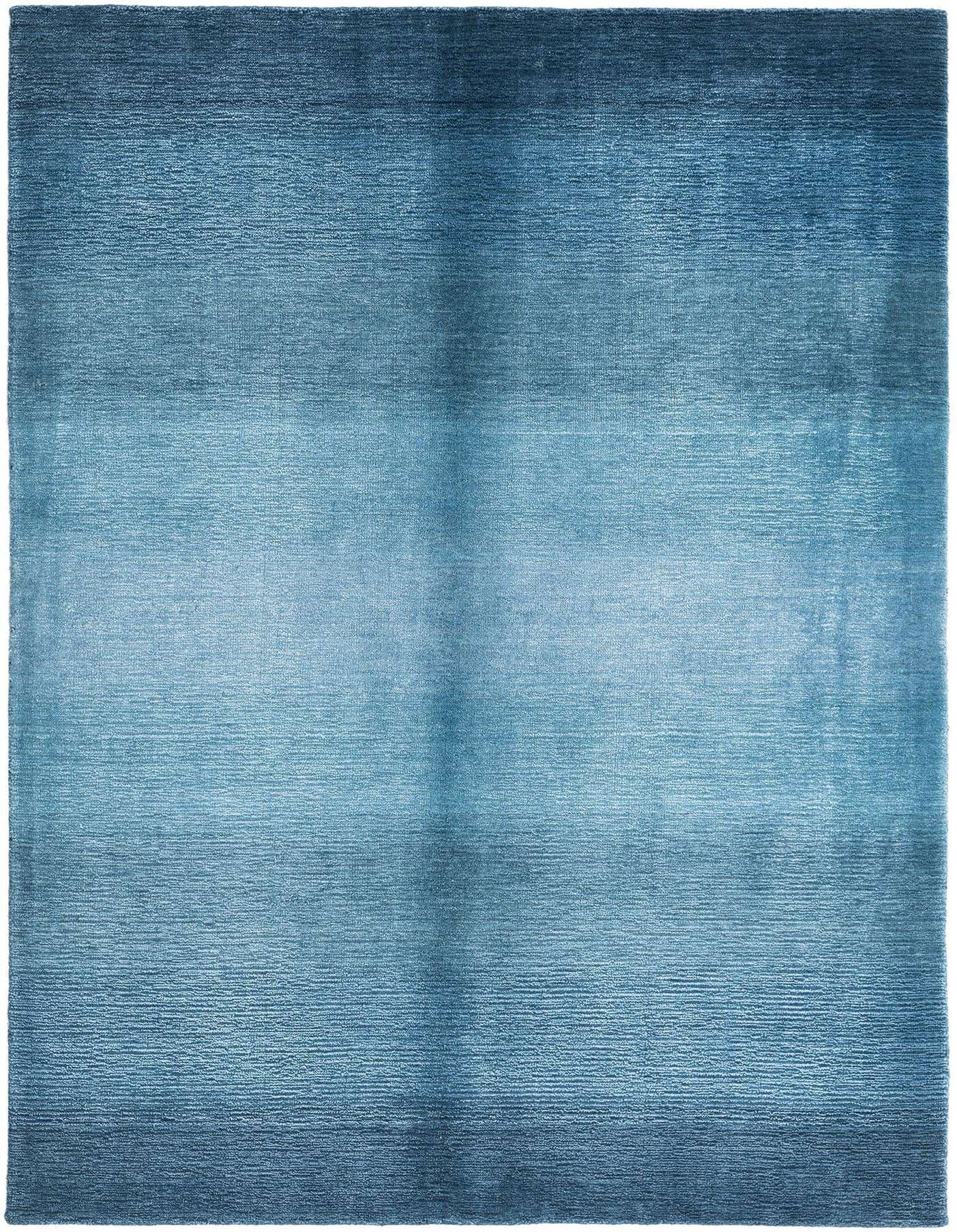 A 3x5 rectangular Darya rug in varying shades of blue, featuring a modern, handmade design.