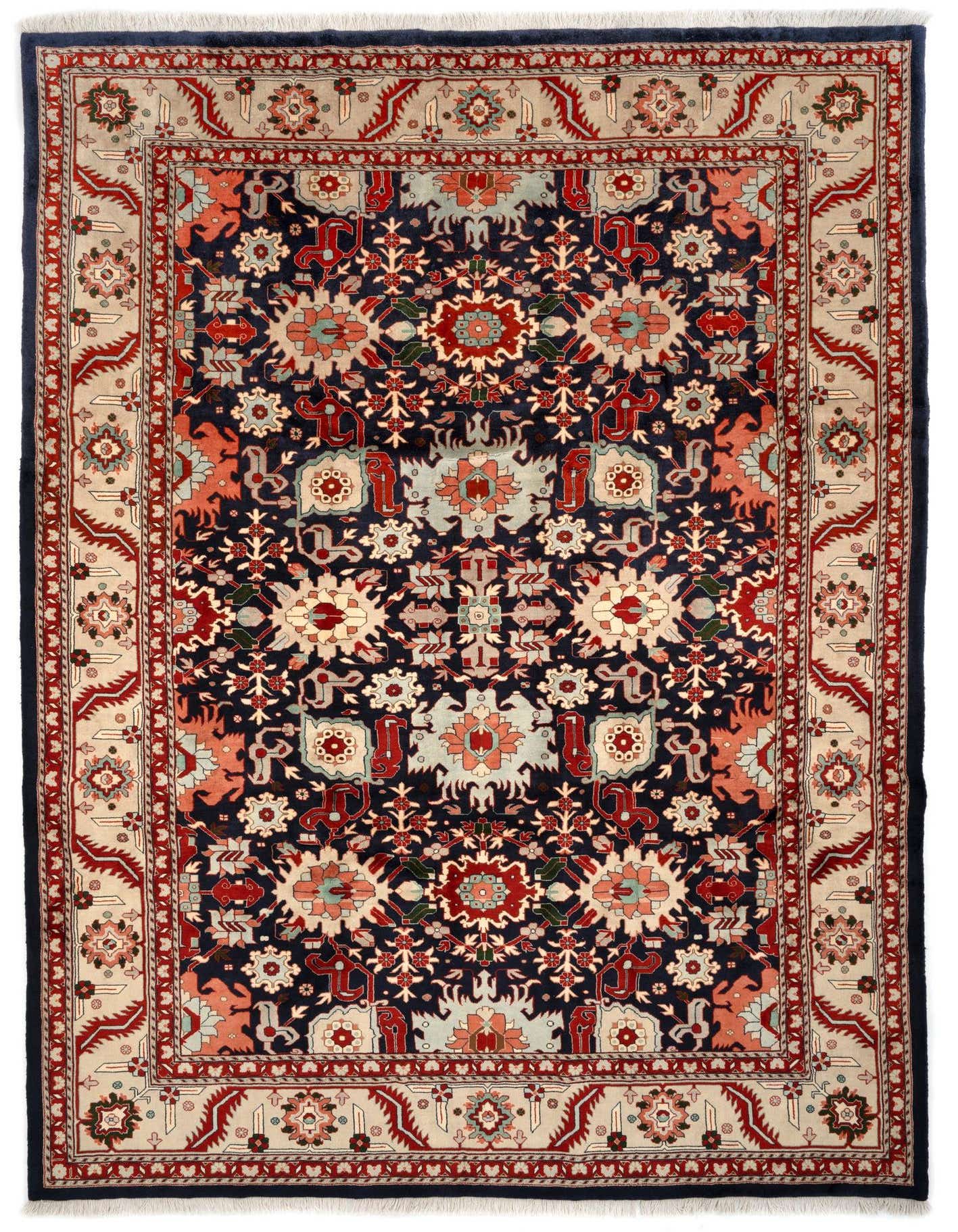 An 8x11 rectangular Indo Tabriz Persian rug with a deep blue field and intricate floral and medallion patterns in red, cream, and light blue, framed by a detailed border.