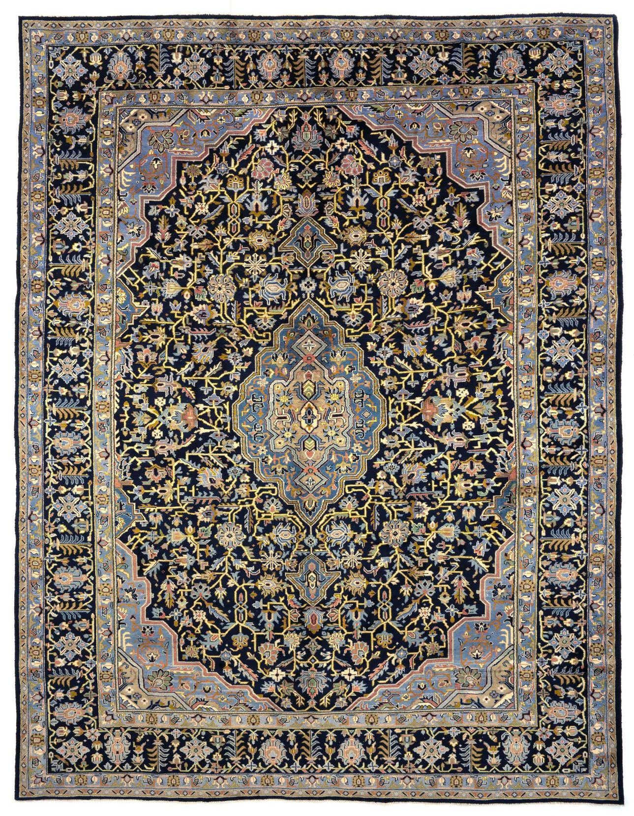 A 10x13 rectangular Persian rug with a dark blue field, intricate floral patterns, and a light blue border.