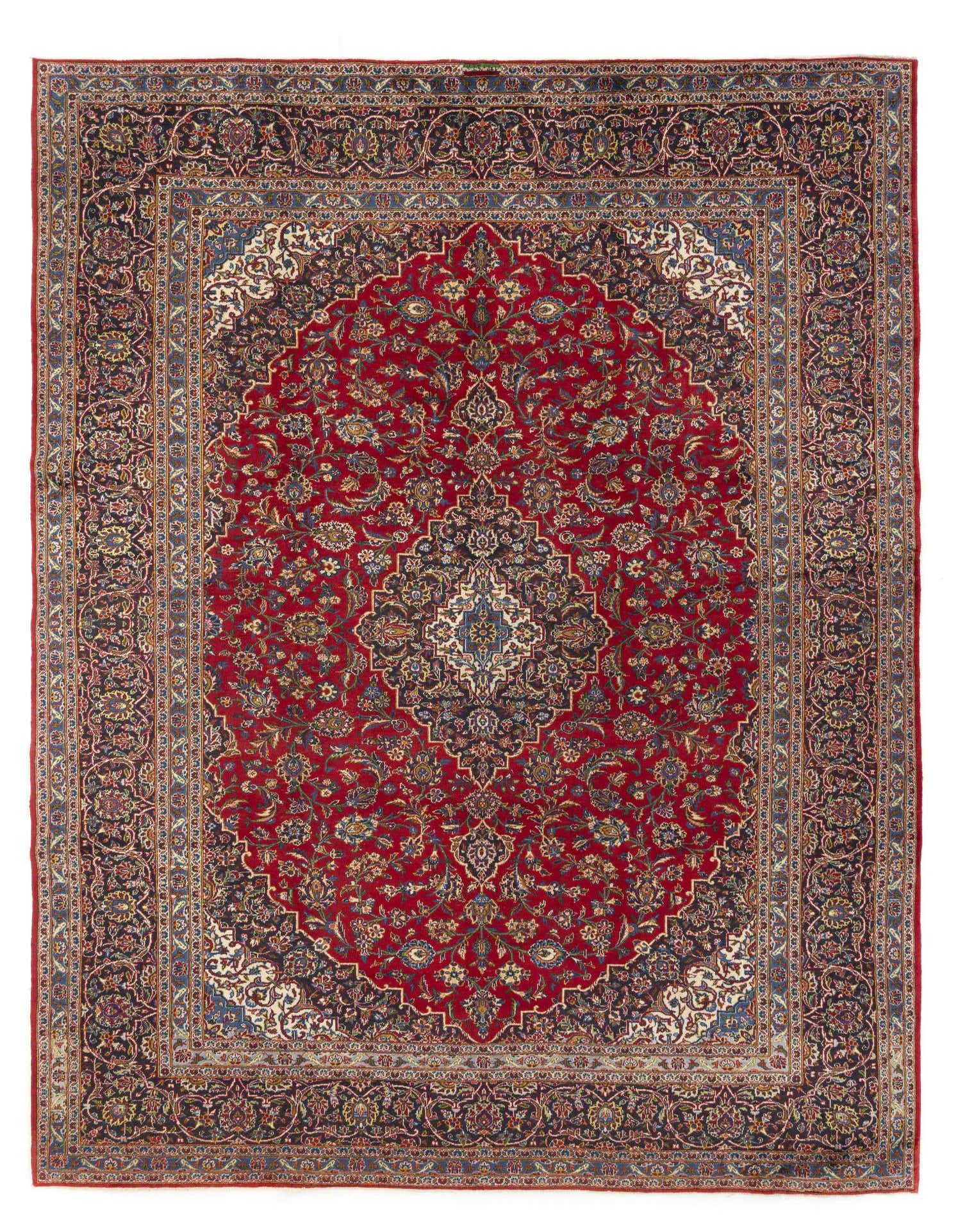 A 9x12 rectangular Persian rug with a deep red field, intricate blue and gold floral patterns, and a central medallion.