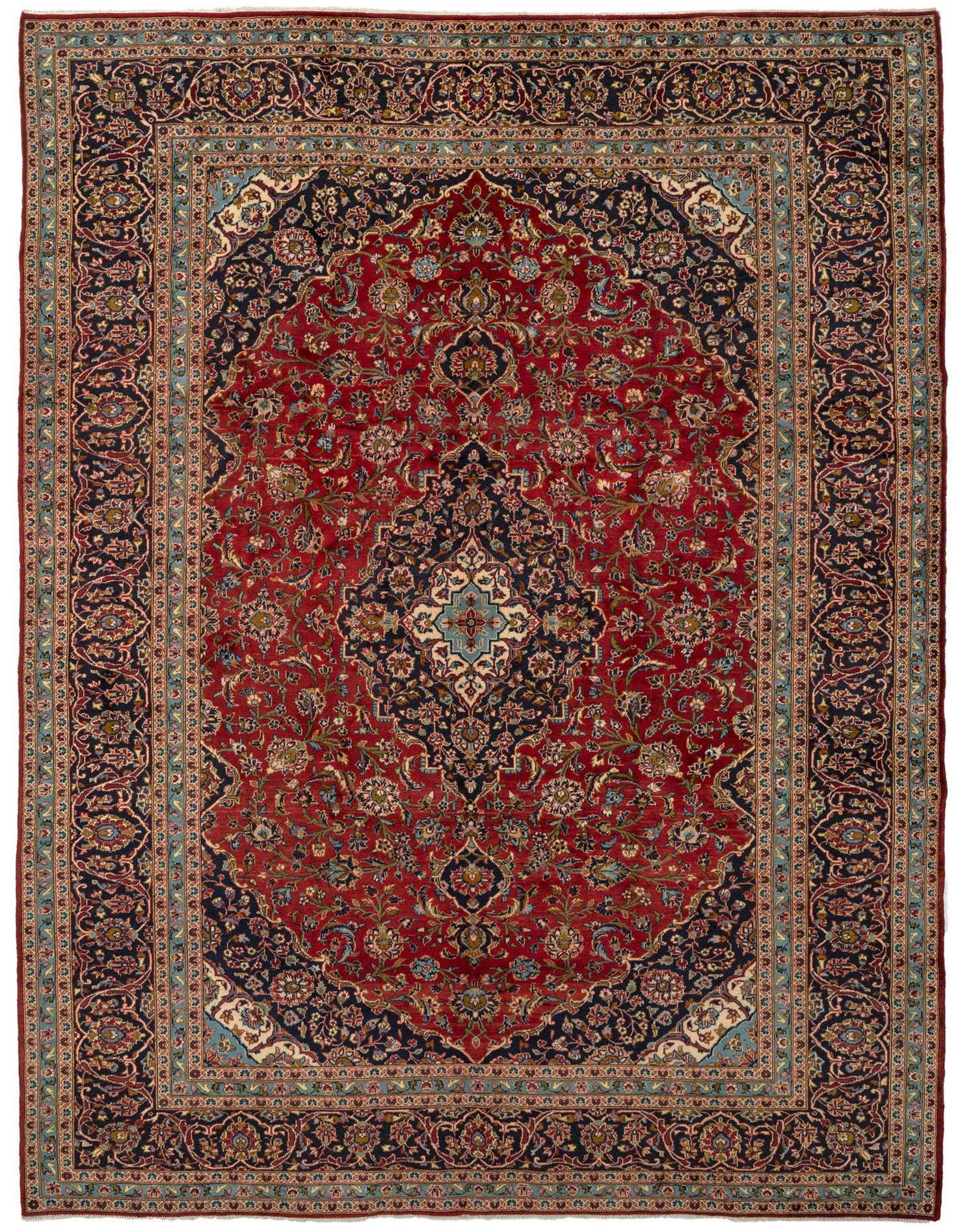 A rectangular 9x12 Kashan Persian rug with a deep red field, navy blue border, and intricate floral patterns.