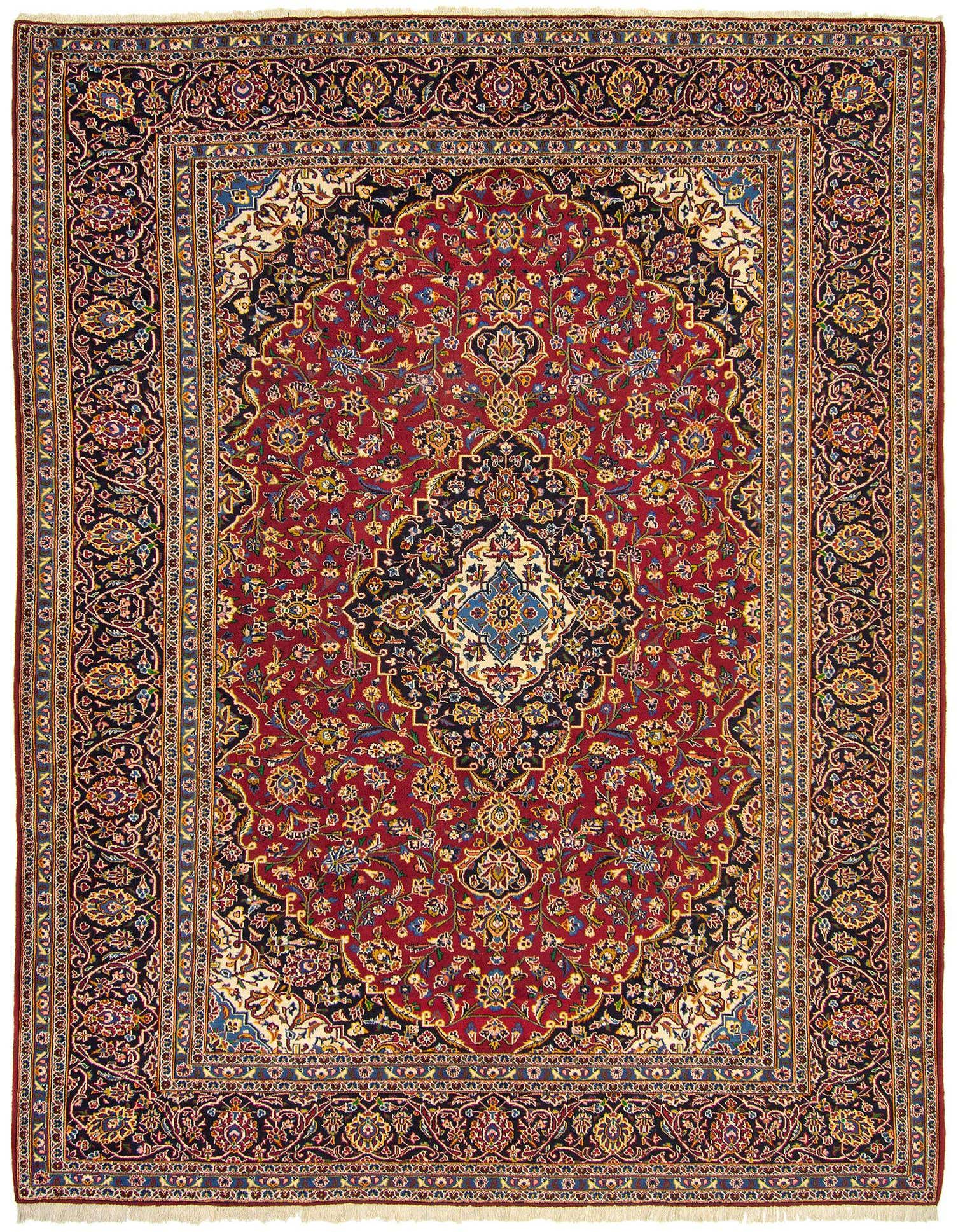 A 10x13 rectangular Persian Kashan rug featuring a rich red field with intricate floral patterns and a central medallion, framed by a dark blue border.