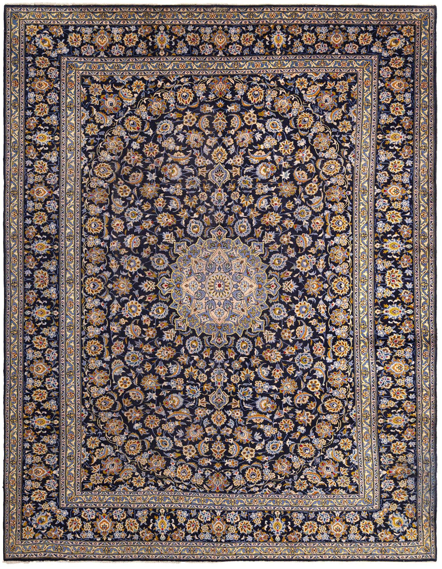 A large 10x13 rectangular Kashmar Persian rug in deep blues with intricate floral patterns and a central medallion.