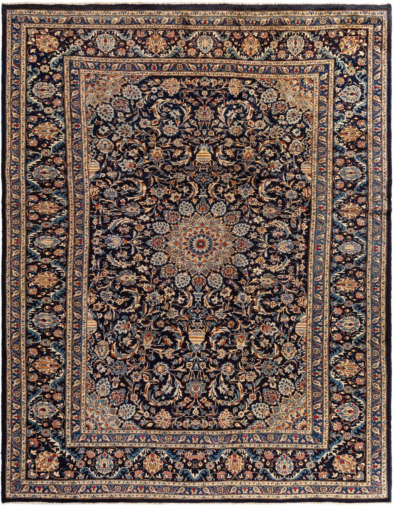 A large 9x12 rectangular Kashmar Persian wool rug featuring intricate floral patterns in various shades of blue, cream, and gold on a dark blue background.