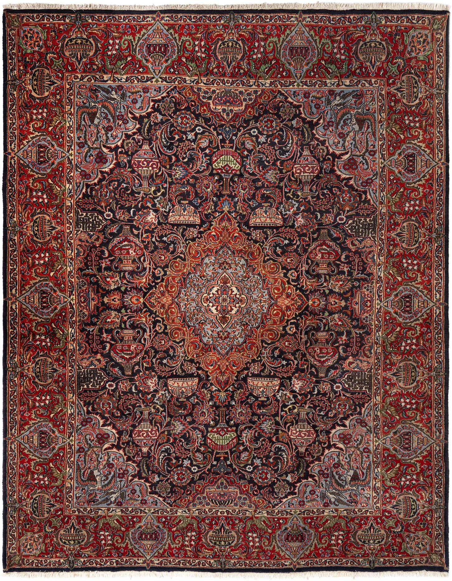 A rectangular 10x13 Kashmar rug featuring a complex traditional pattern in deep blues, reds, and creams, with a central medallion and intricate floral motifs.