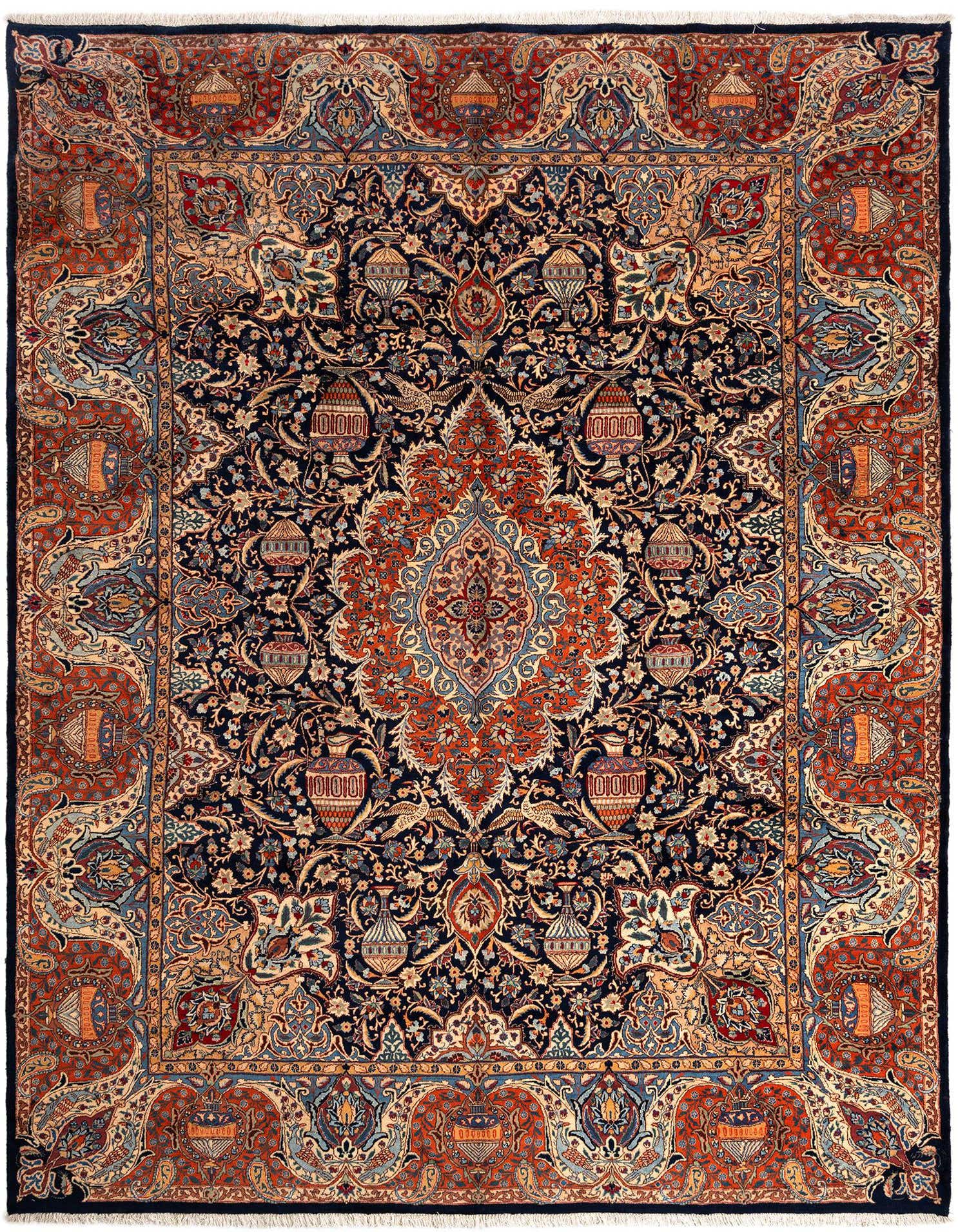 A large 10x13 rectangular Persian rug in deep blues and rich reds, featuring an intricate floral medallion pattern.