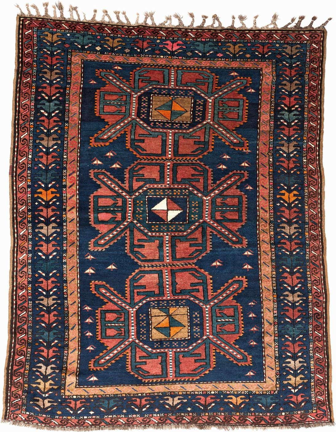 A 4x6 rectangular blue Kazak rug with intricate geometric patterns in red, orange, and teal, suitable for an entryway or living room.