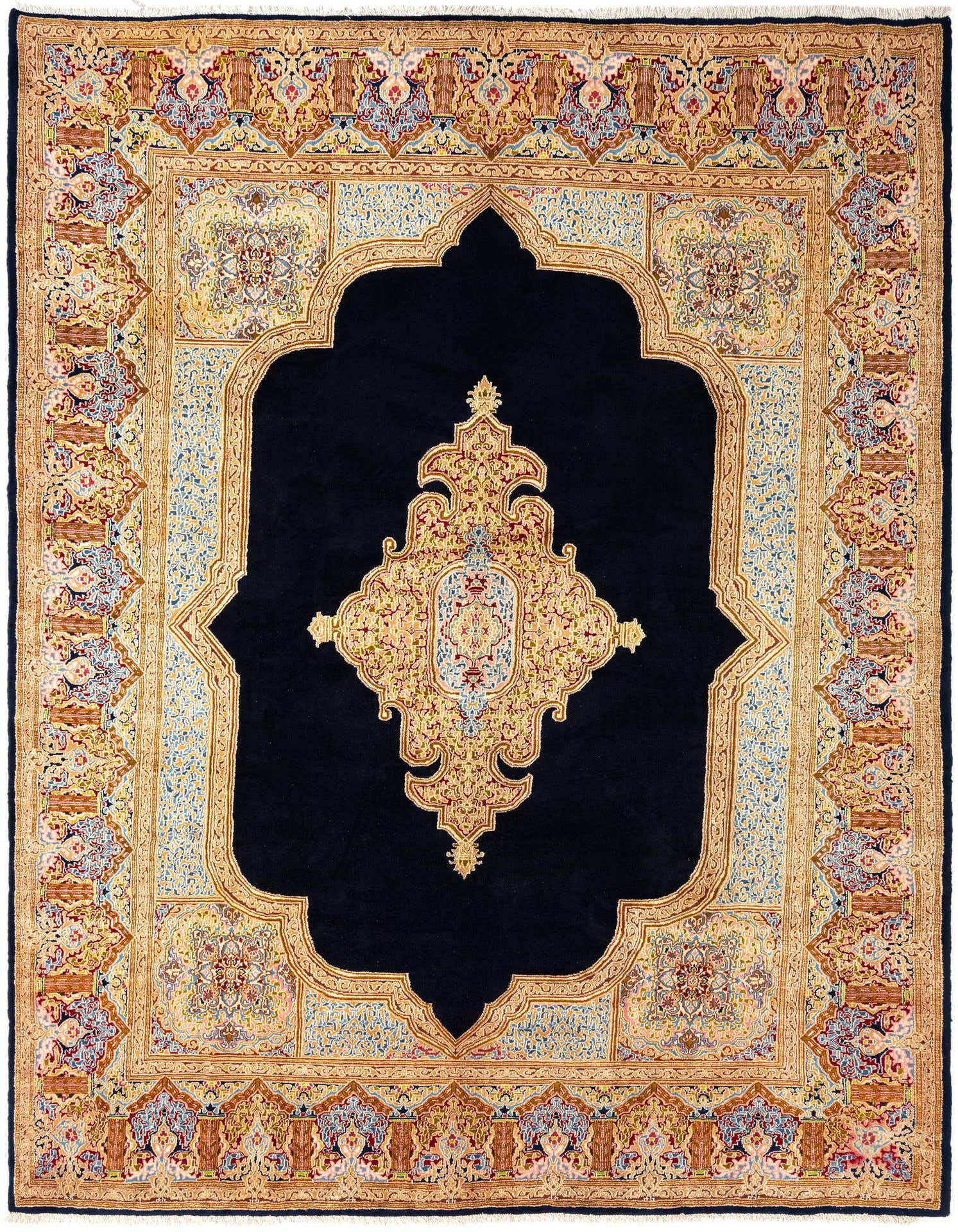 A large 10x13 rectangular Kerman Persian rug featuring a deep blue field with an elaborate gold, red, and light blue floral medallion and border.
