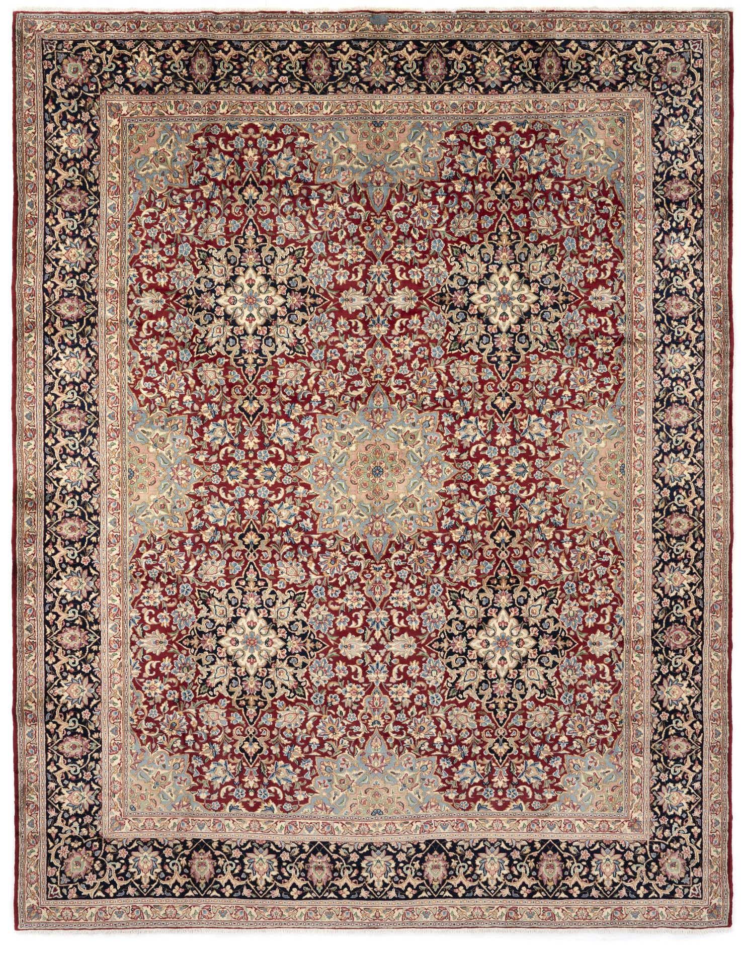 A rectangular 9x12 Kerman Persian rug featuring a detailed floral pattern in deep blues, reds, and creams.