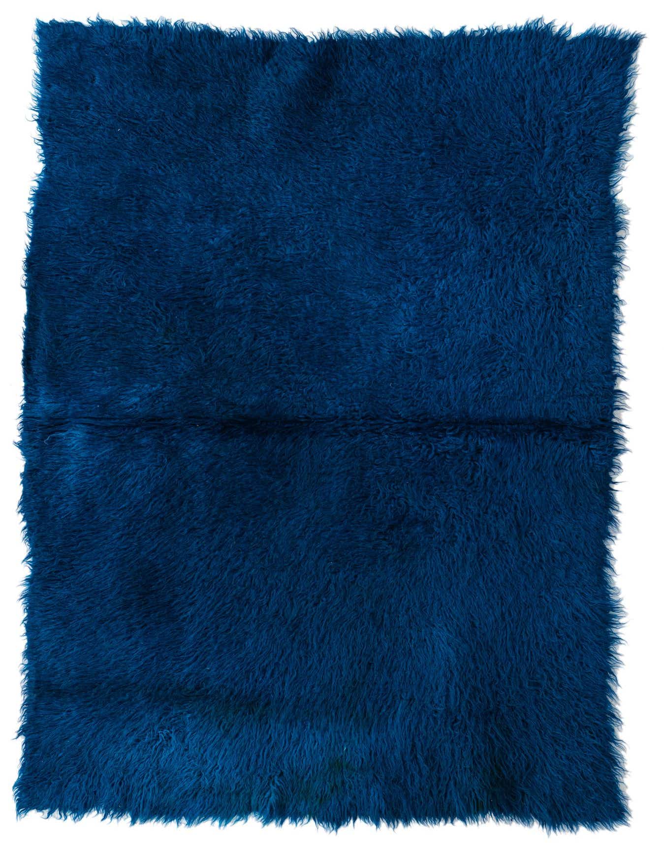 A rectangular 3x5 blue shag area rug made of wool, featuring a plush, shaggy texture.