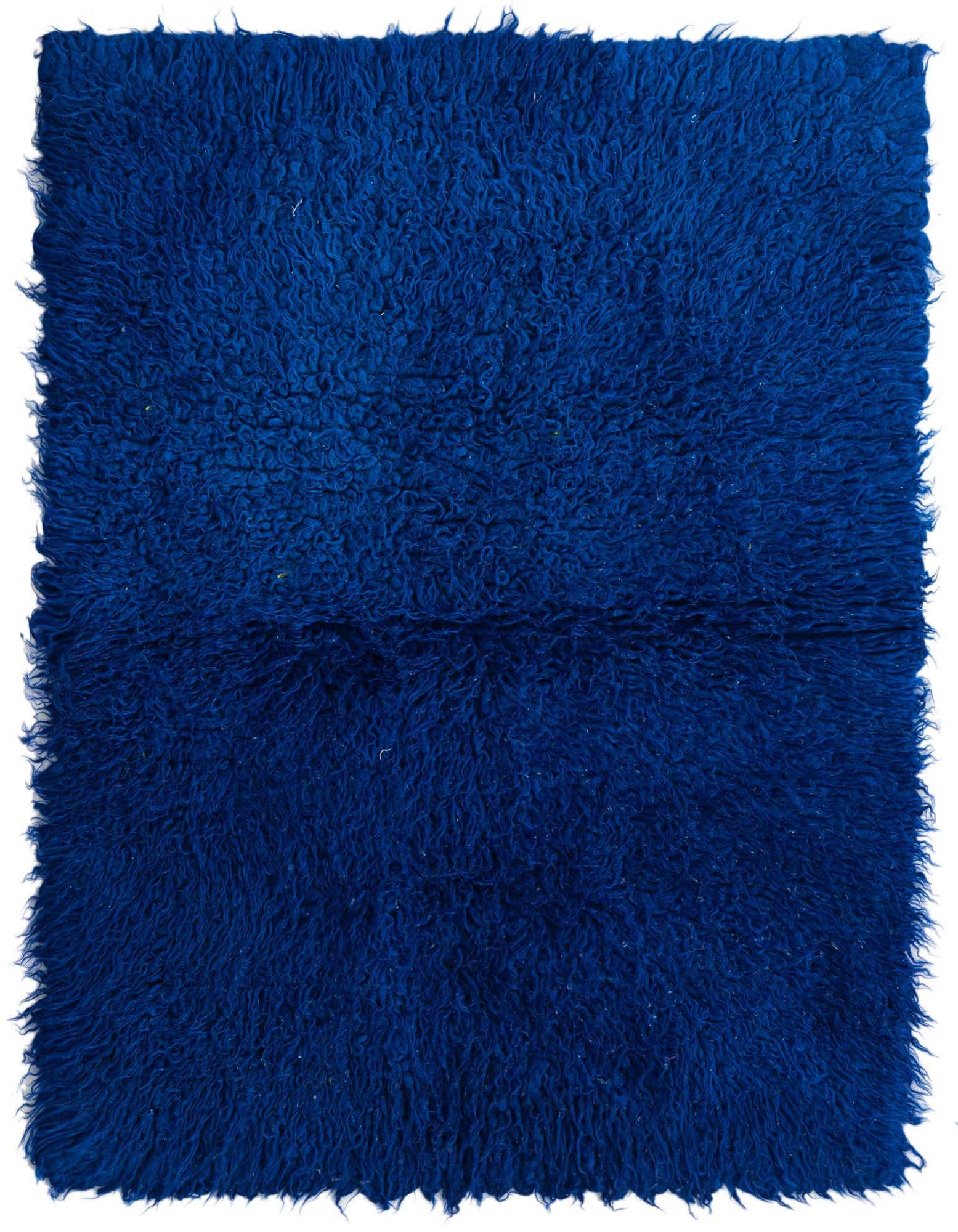 A rectangular 3x4 blue shag rug made of 100% wool, featuring a plush, textured pile.