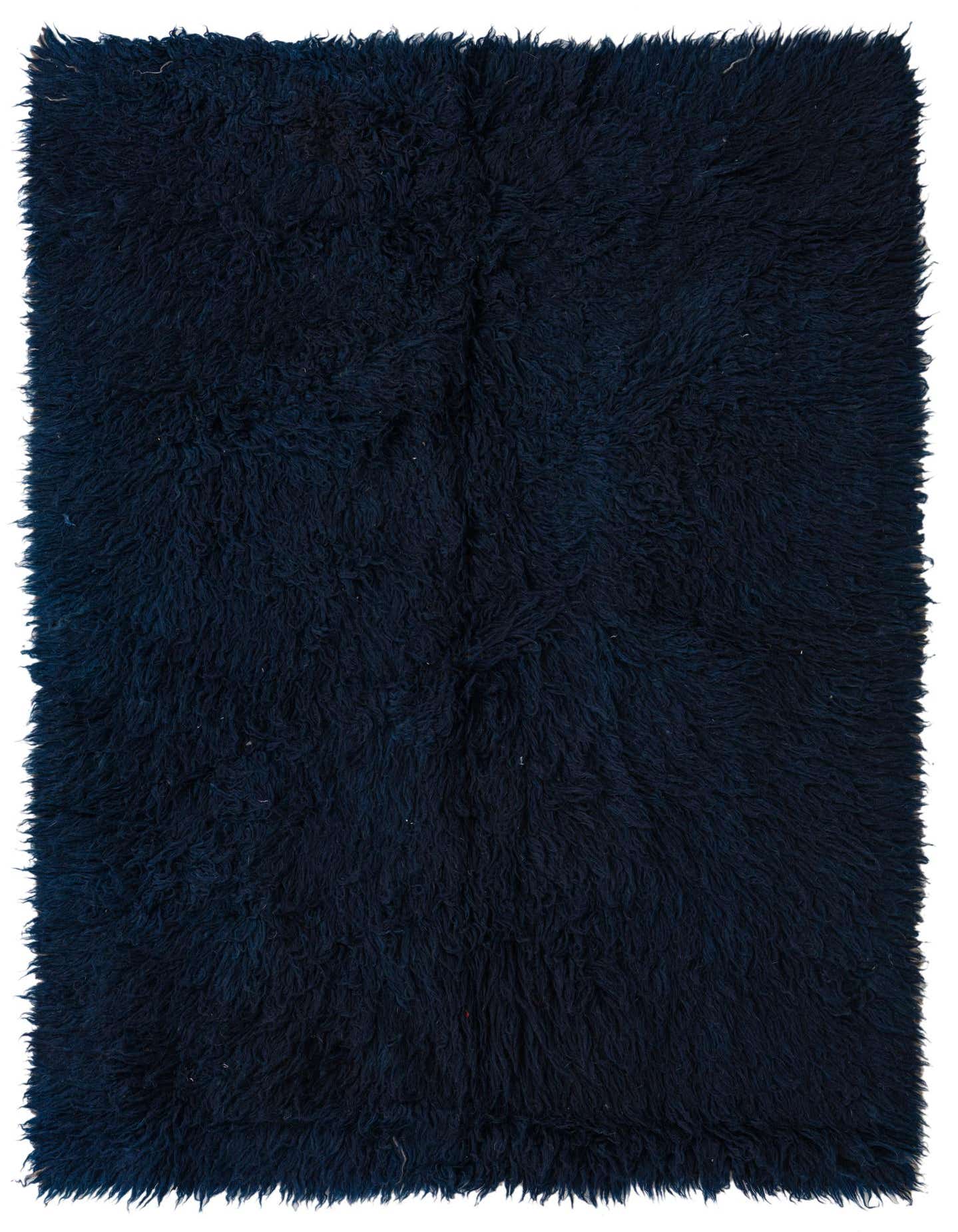 A rectangular 4x6 navy blue shag rug with a thick, plush pile, perfect for a cozy living room.