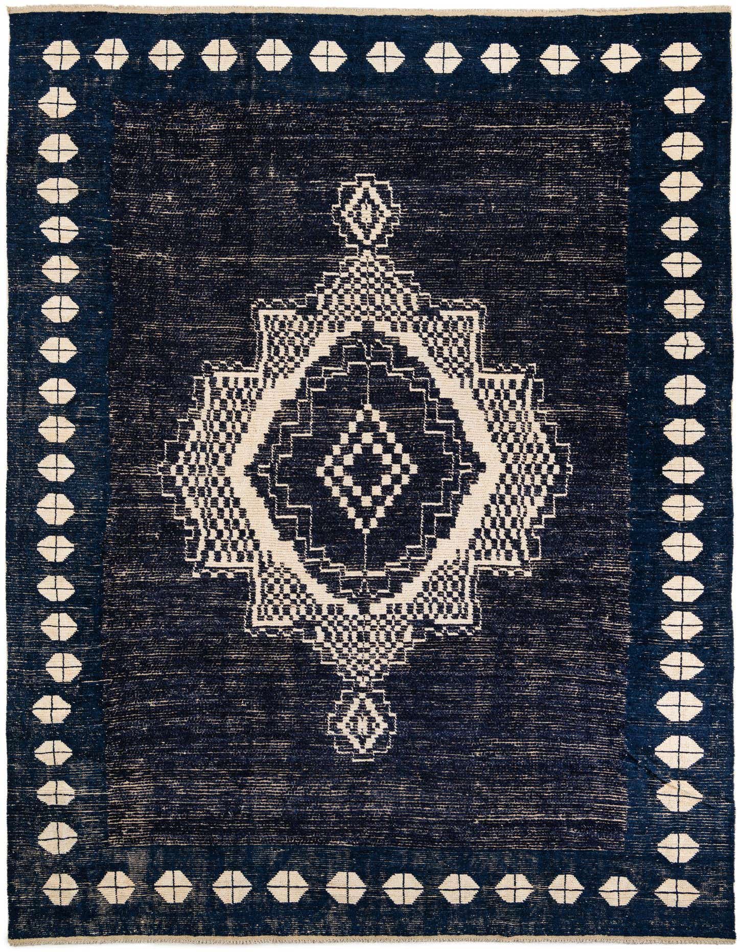 A 10x14 rectangular blue Moroccan shag rug with a large off-white tribal geometric pattern in the center and a matching border.