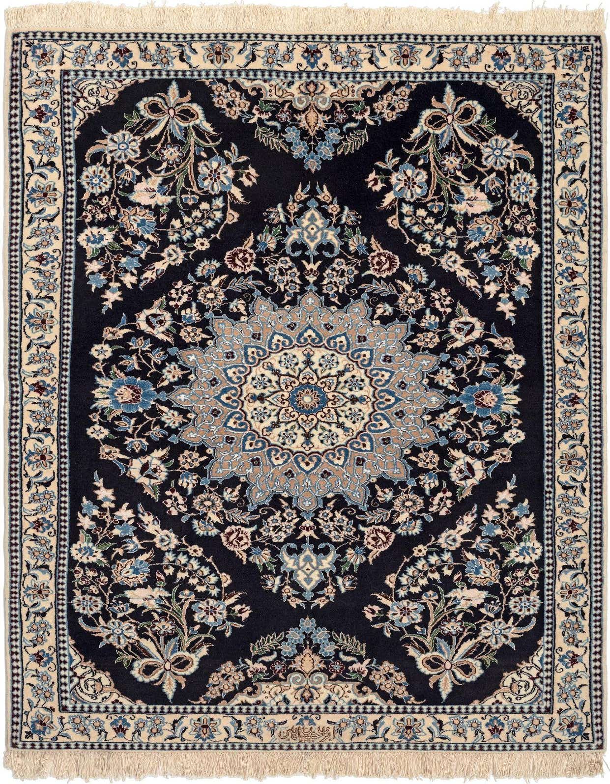 A 3x5 rectangular indoor rug with a dark blue background and intricate floral patterns in lighter blues, beige, and cream, featuring a central medallion design and fringed edges.