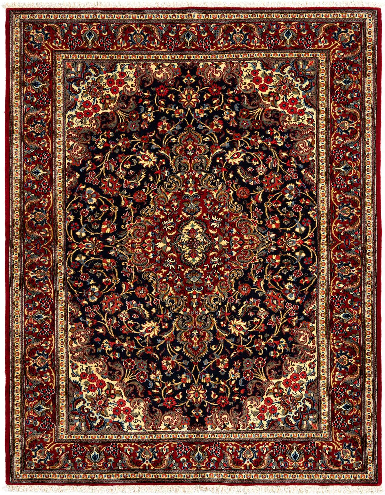 A rectangular 5x7 Persian Qom rug with a dark blue field, intricate floral patterns in red, gold, and cream, and a rich red border.