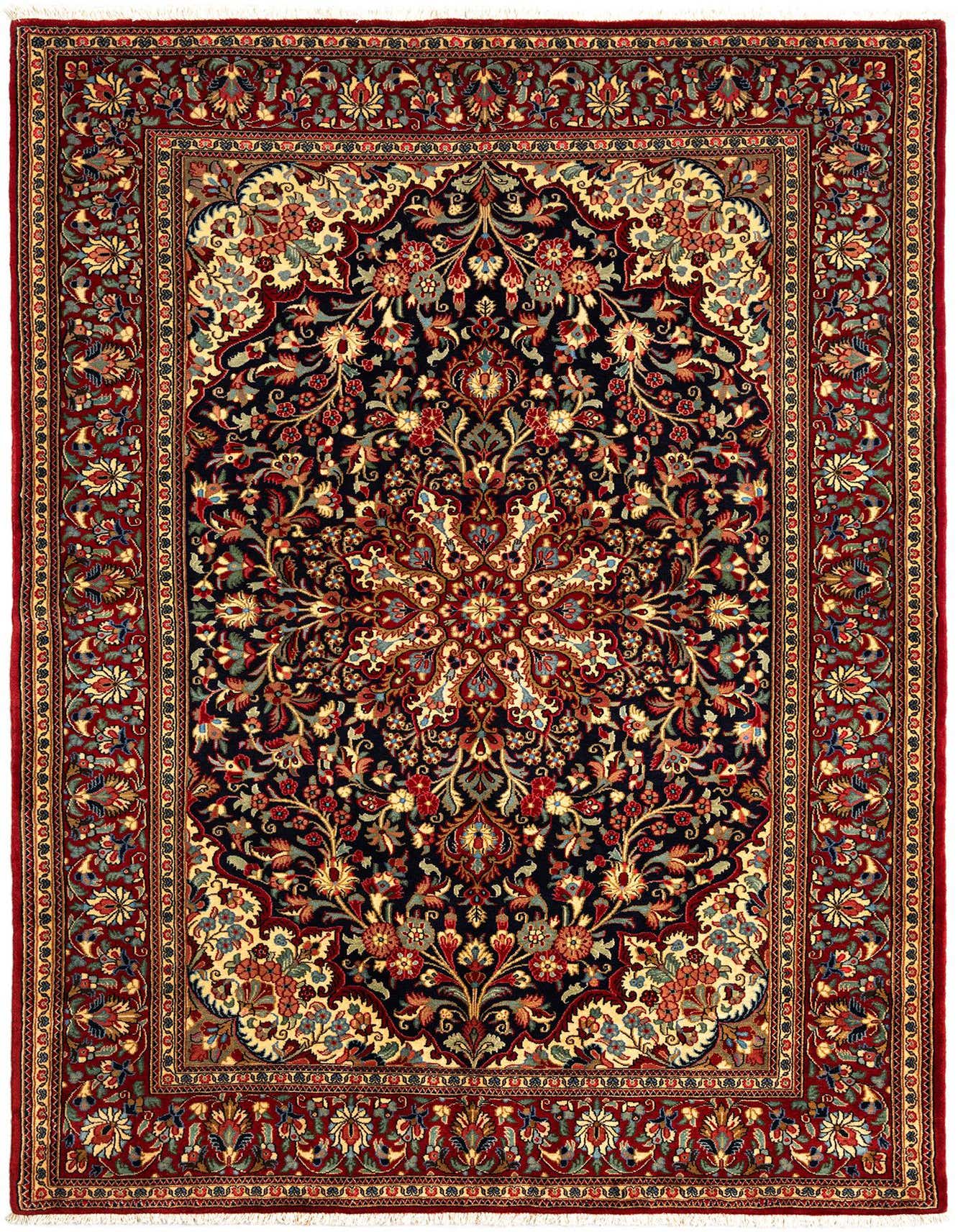 A 5x7 rectangular Persian Qom rug with a detailed floral medallion pattern in deep blues, reds, and creams.